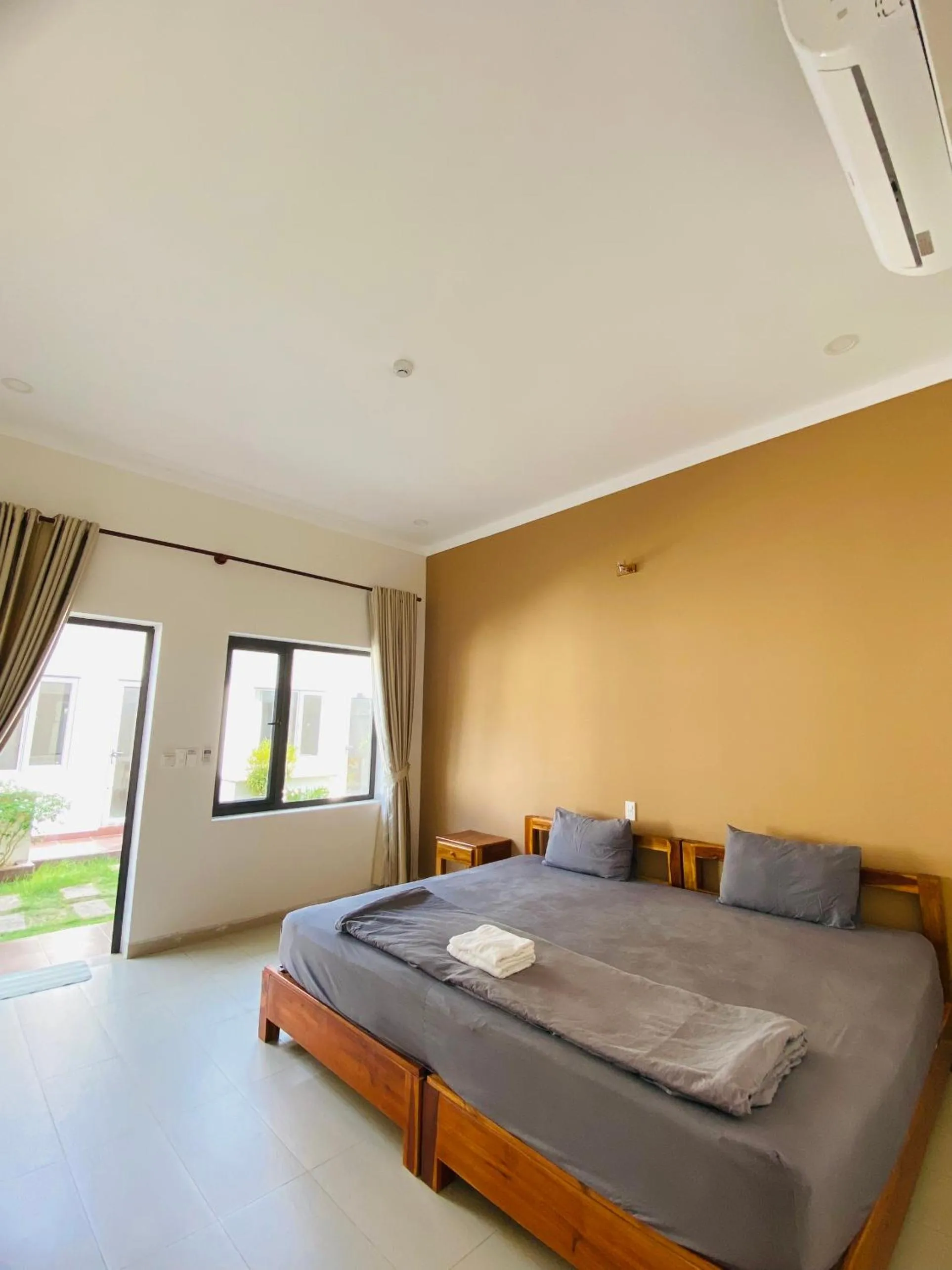 Bed in ARECA MUINE HOMESTAY