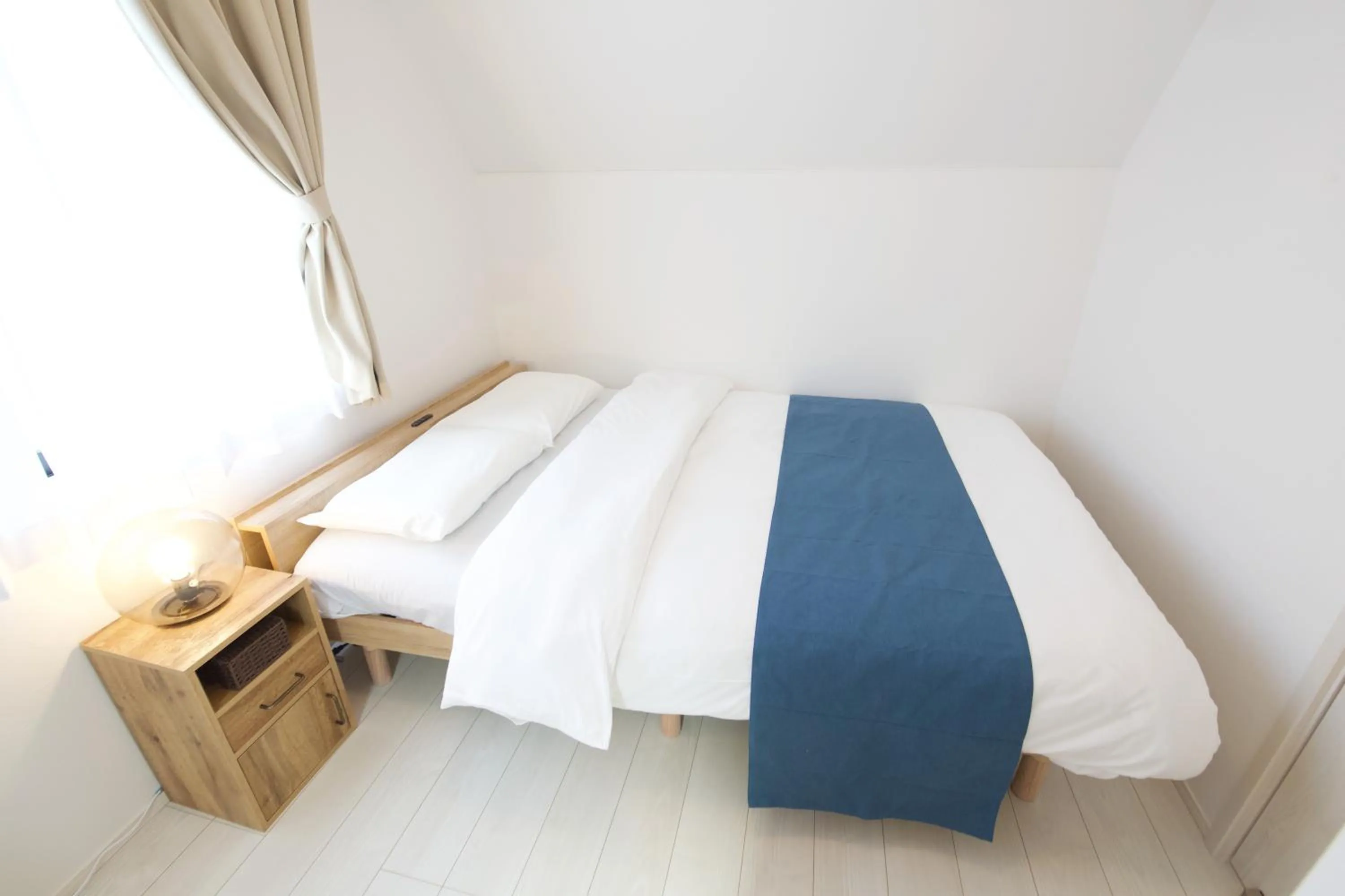 Bed in FINOA Residential Suite Kameari