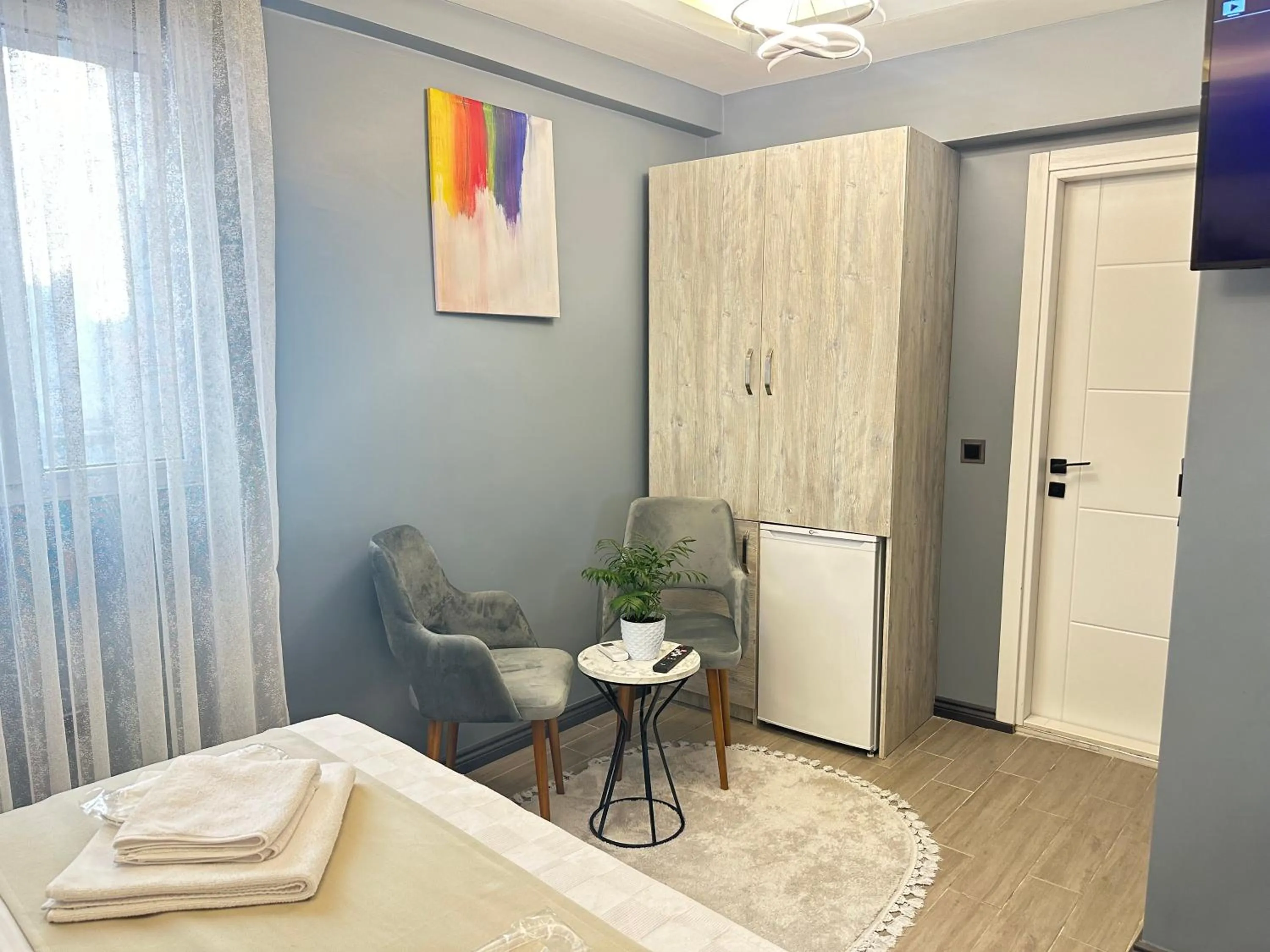 Living room, Bed in Blue Moonrise Hotel