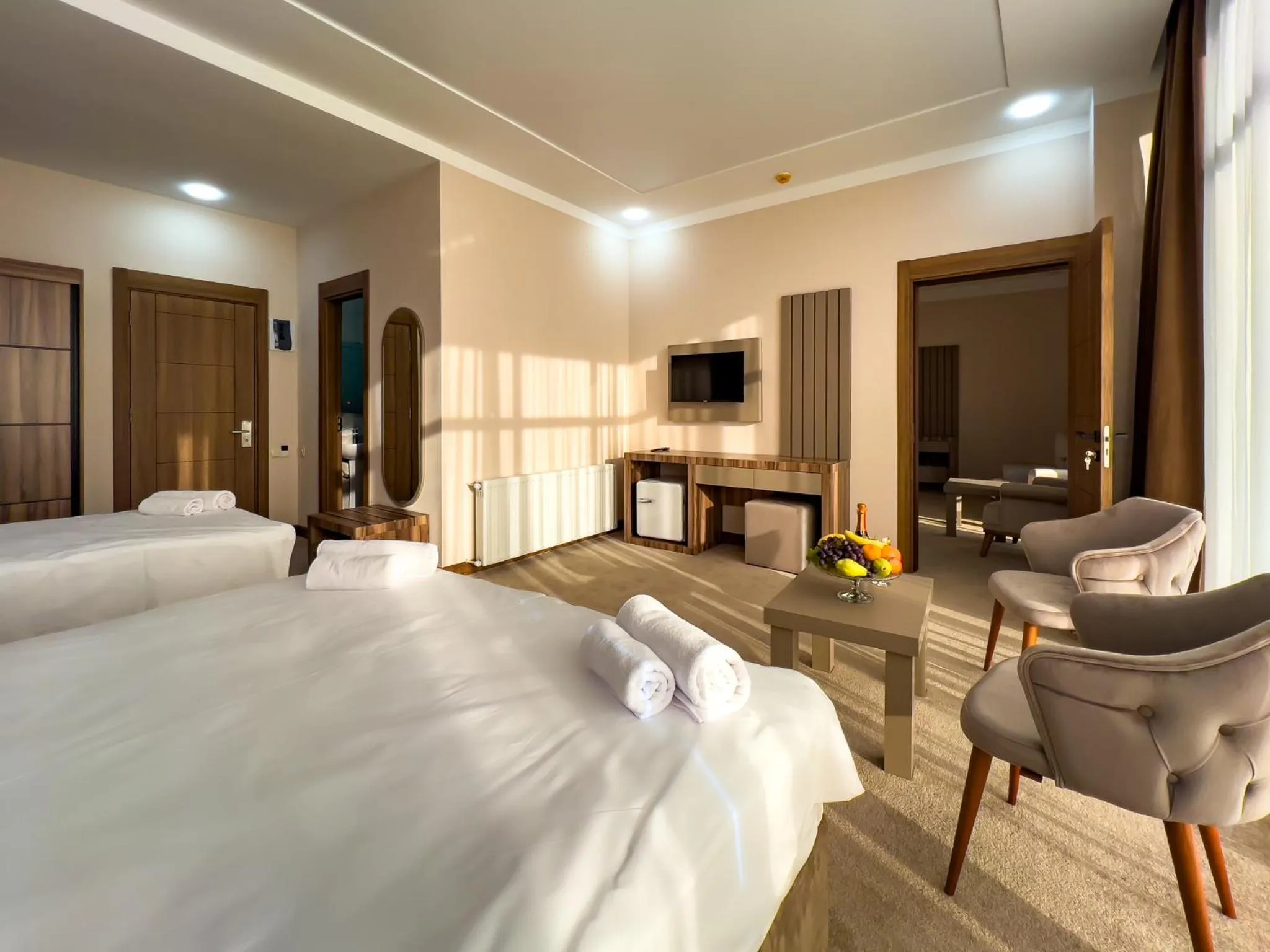 Communal lounge/ TV room, Bed in Chateau Milisi