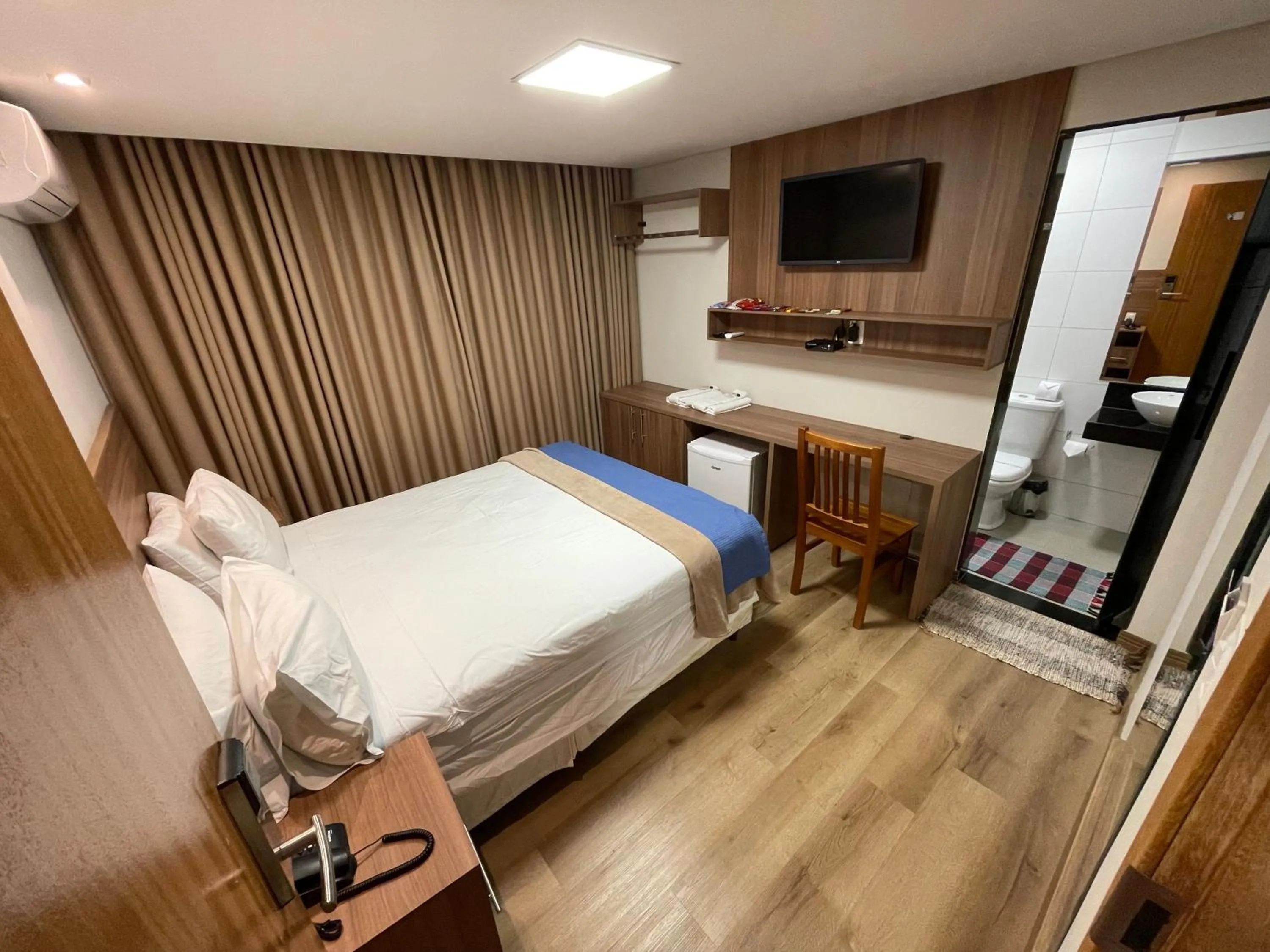 Bed in Pousada Circuito dos Inconfidentes