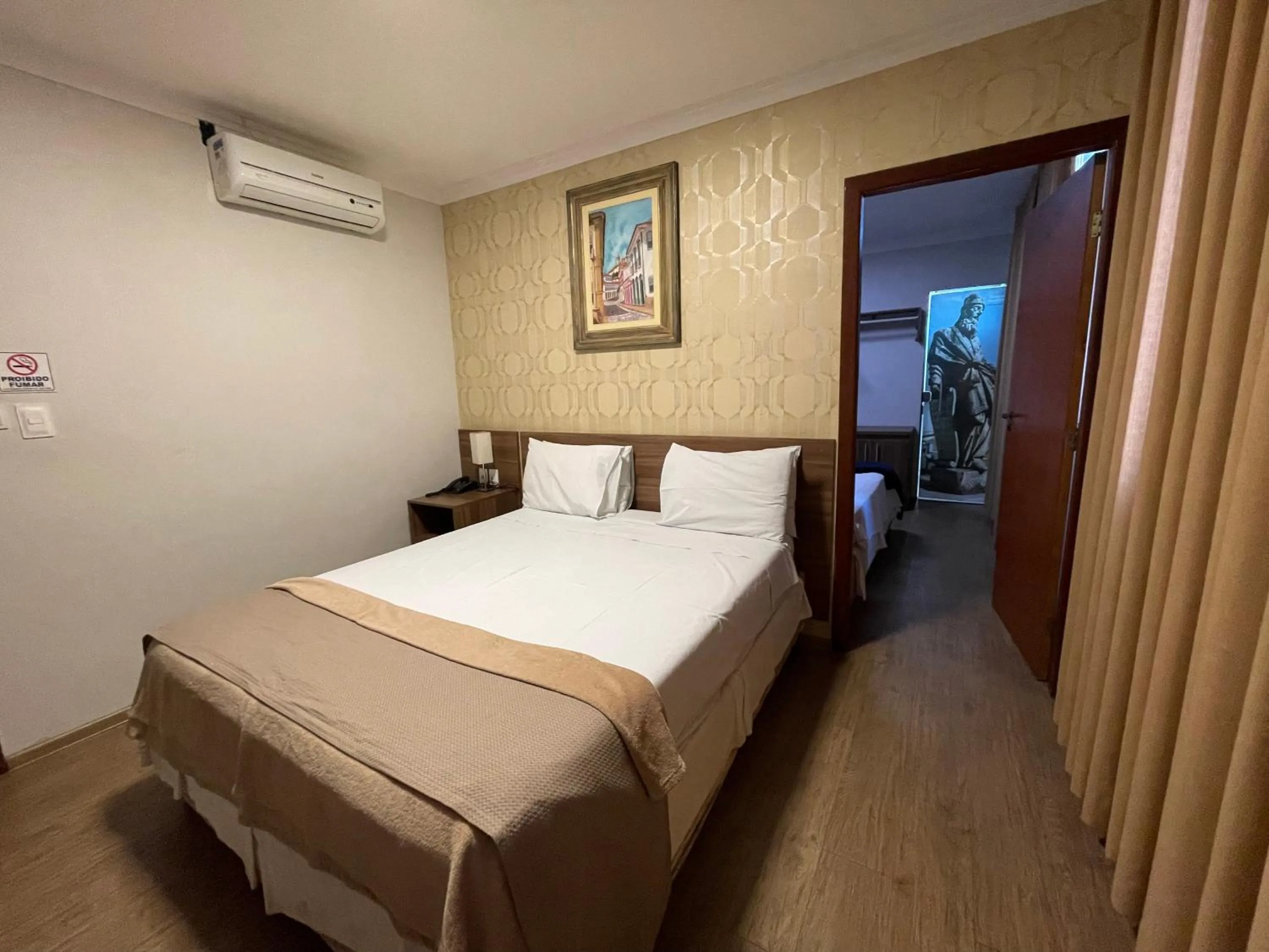 Bed in Pousada Circuito dos Inconfidentes