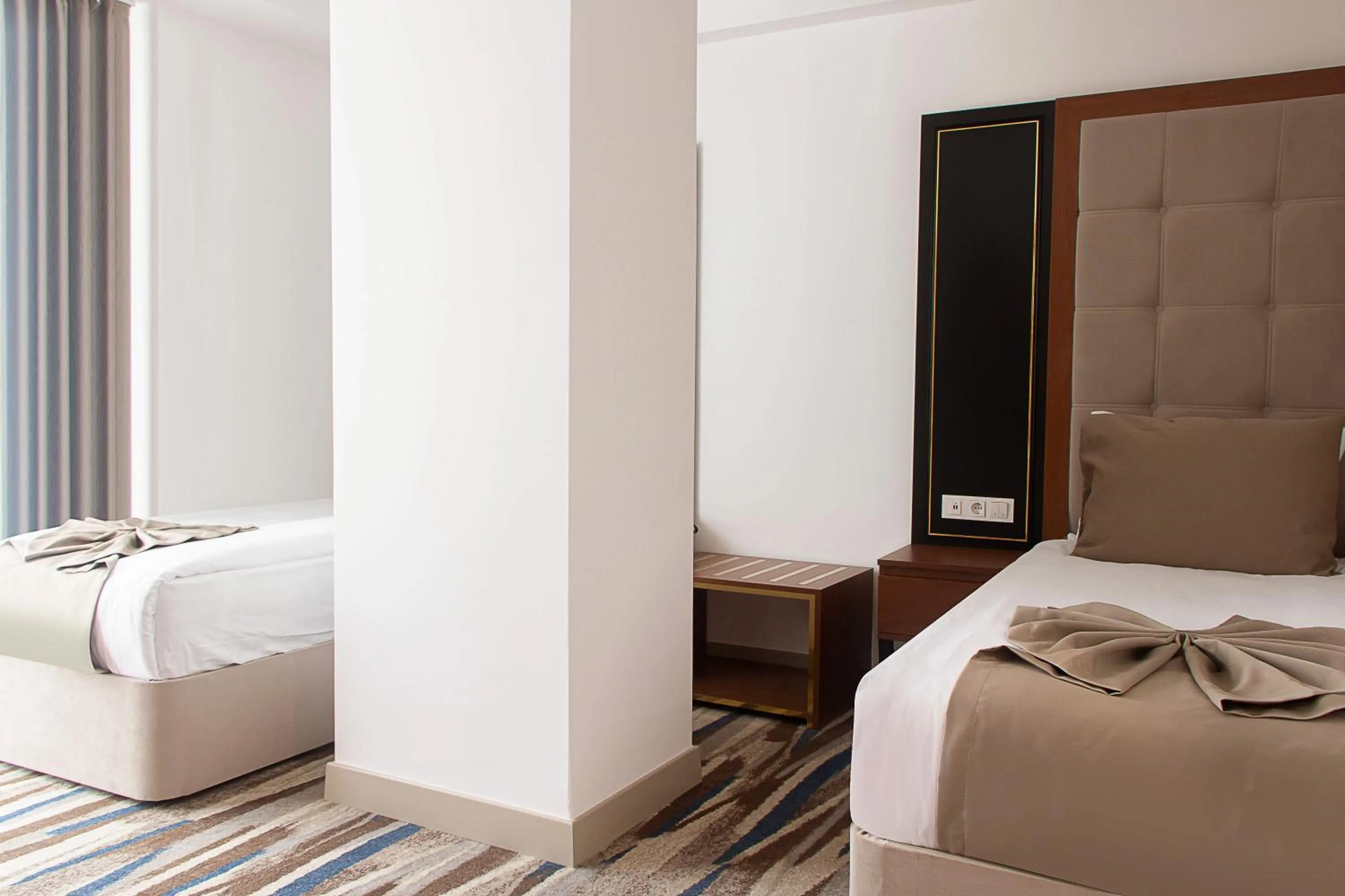 Bed in Shelter Inn Hotel & Spa