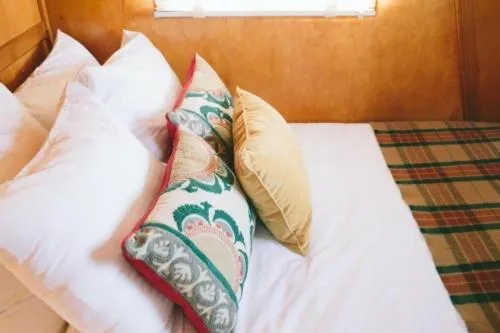Seating area, Bed in The Vintages Trailer Resort