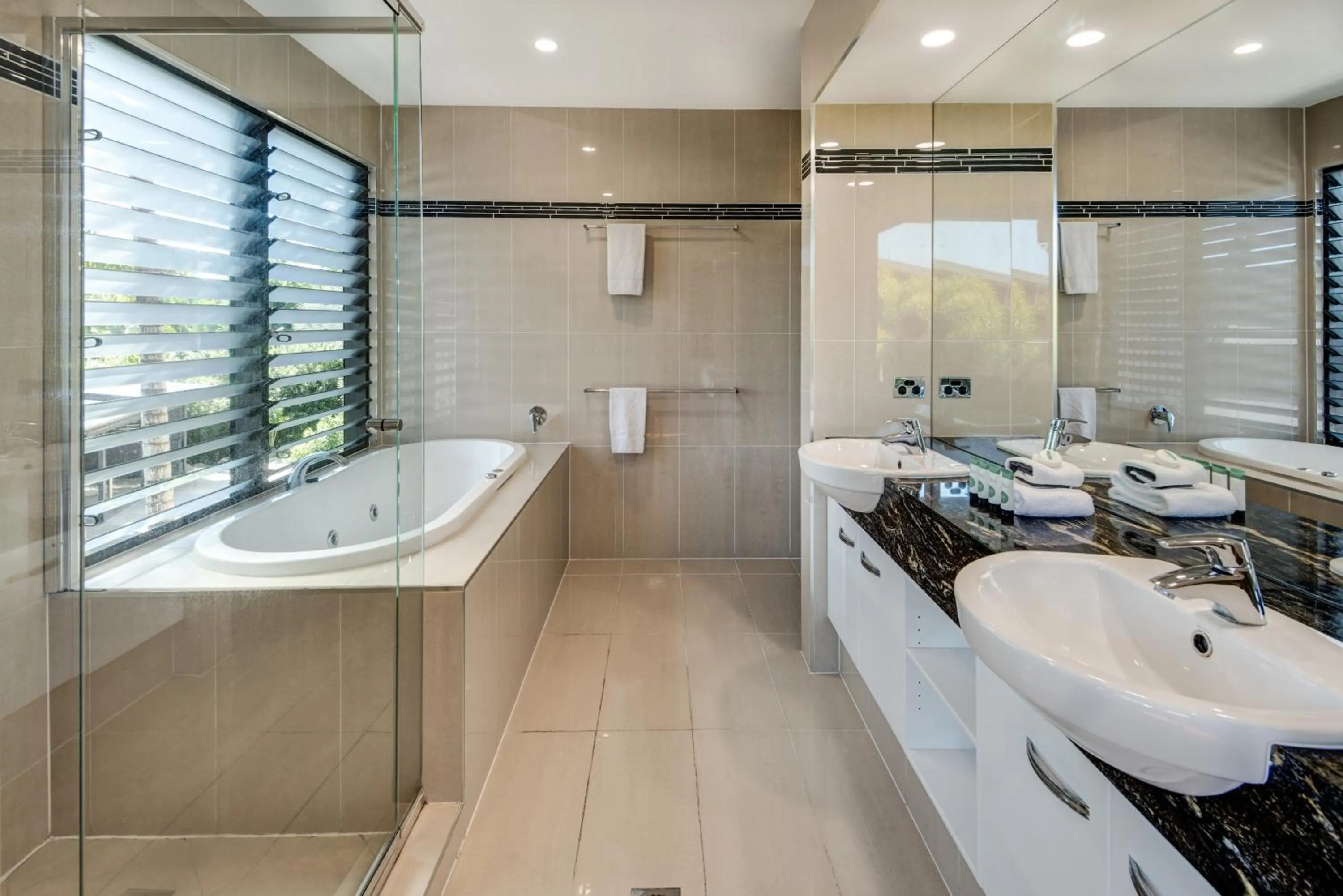 Bathroom in Pinnacle Apartments on Hamilton Island by HIHA