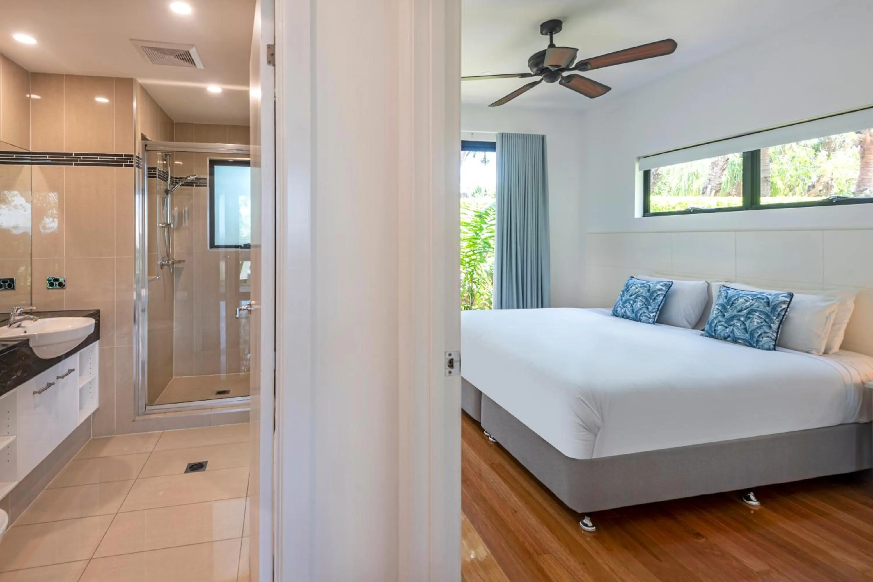 Bathroom, Bed in Pinnacle Apartments on Hamilton Island by HIHA