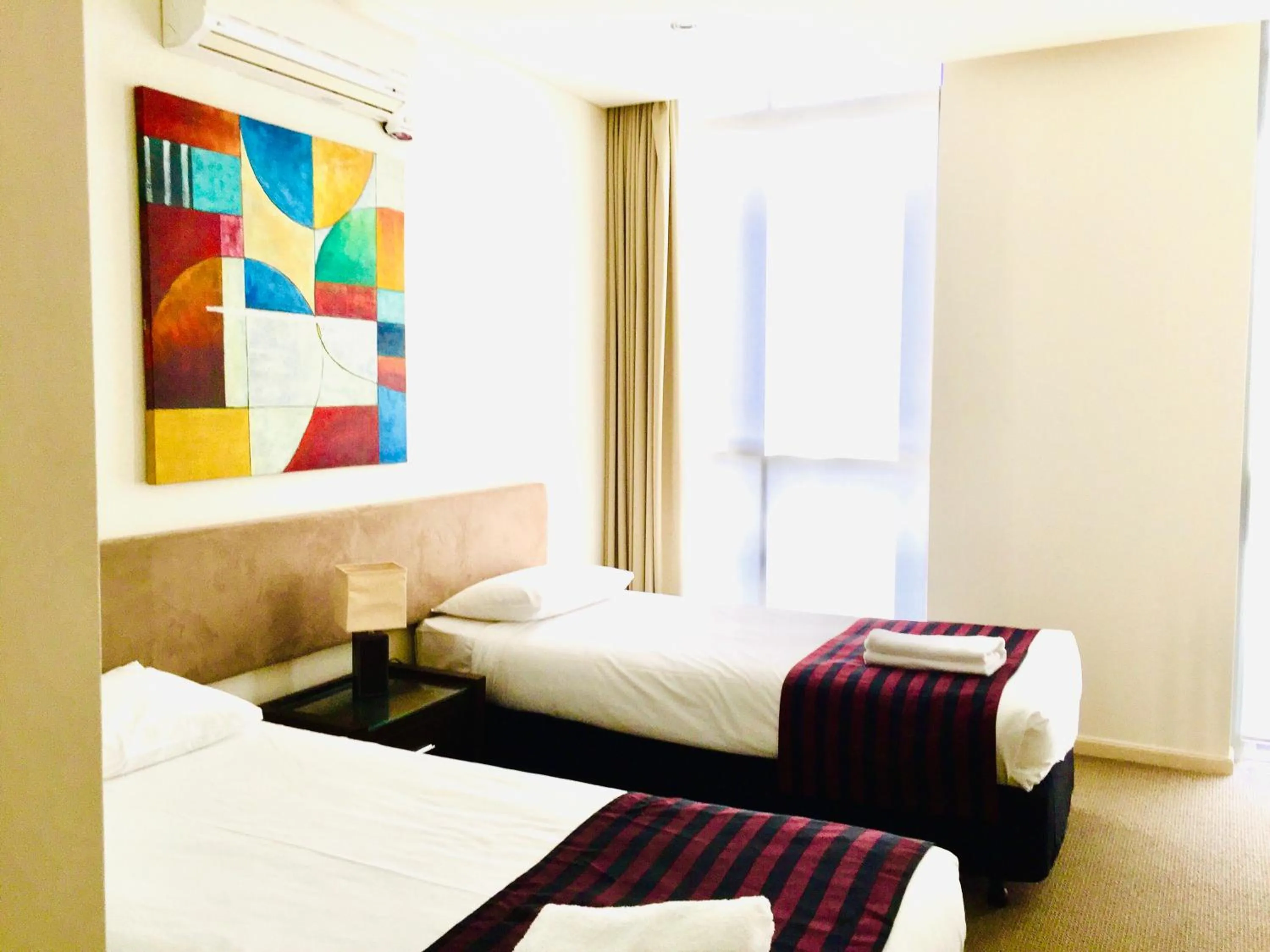 Bed in Solaire Apartments