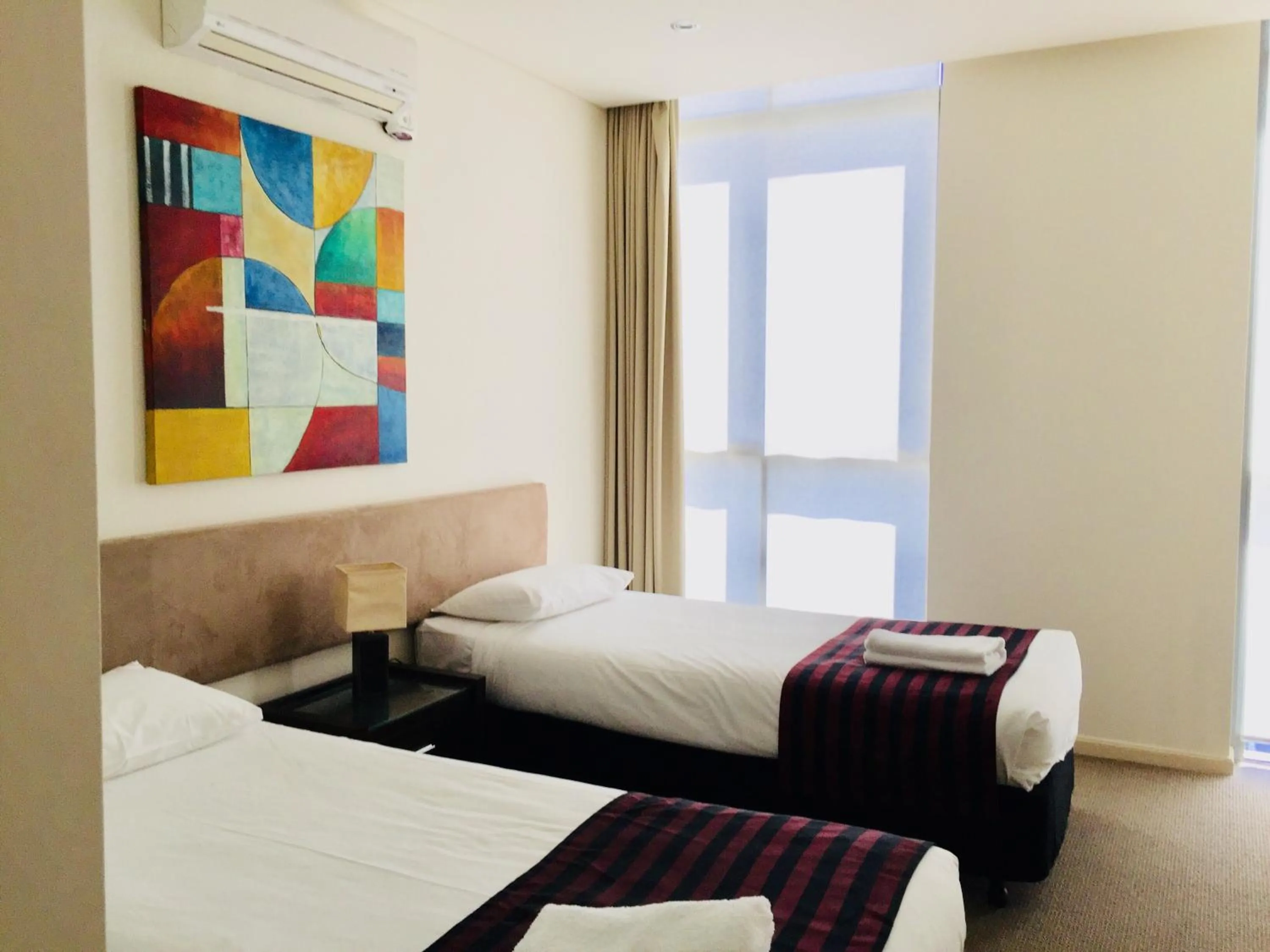 Bed in Solaire Apartments