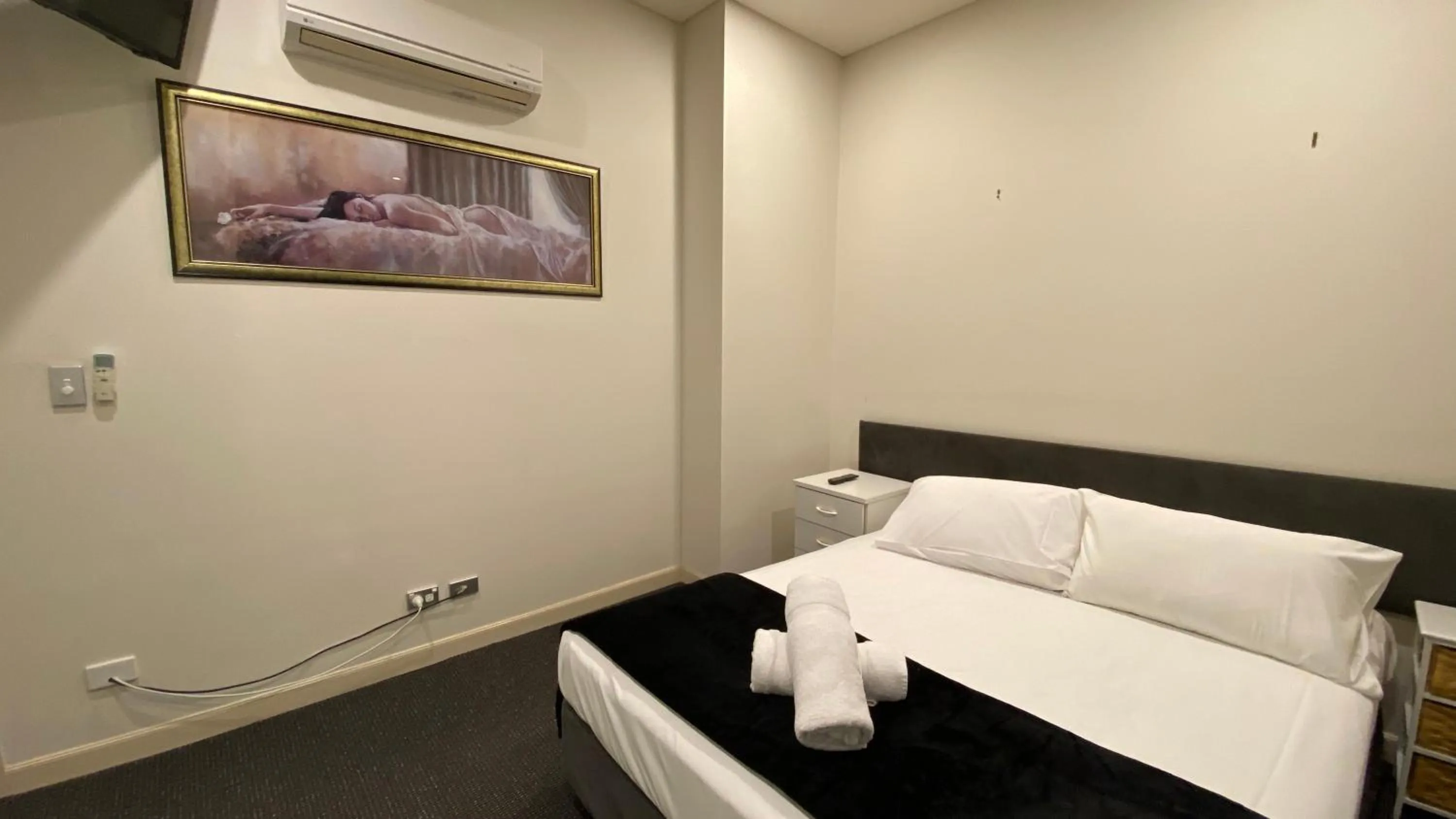 Bed in Solaire Apartments