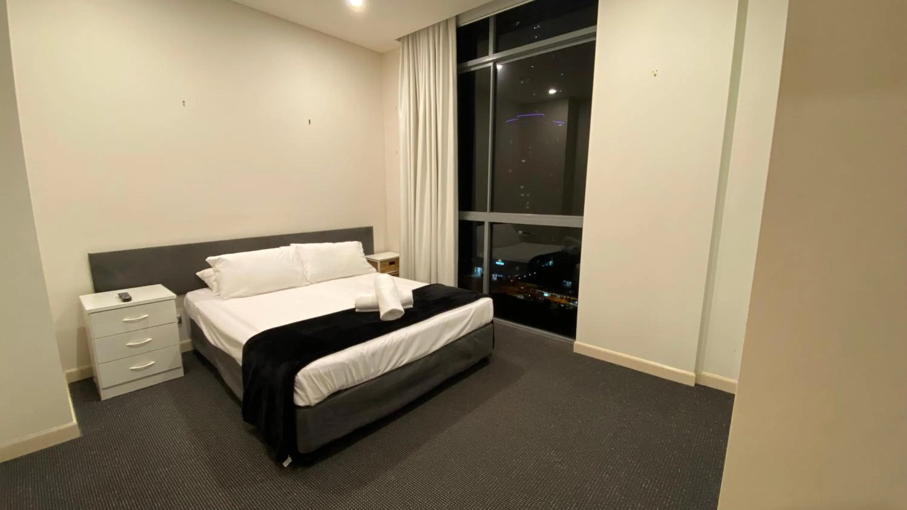 Bed in Solaire Apartments