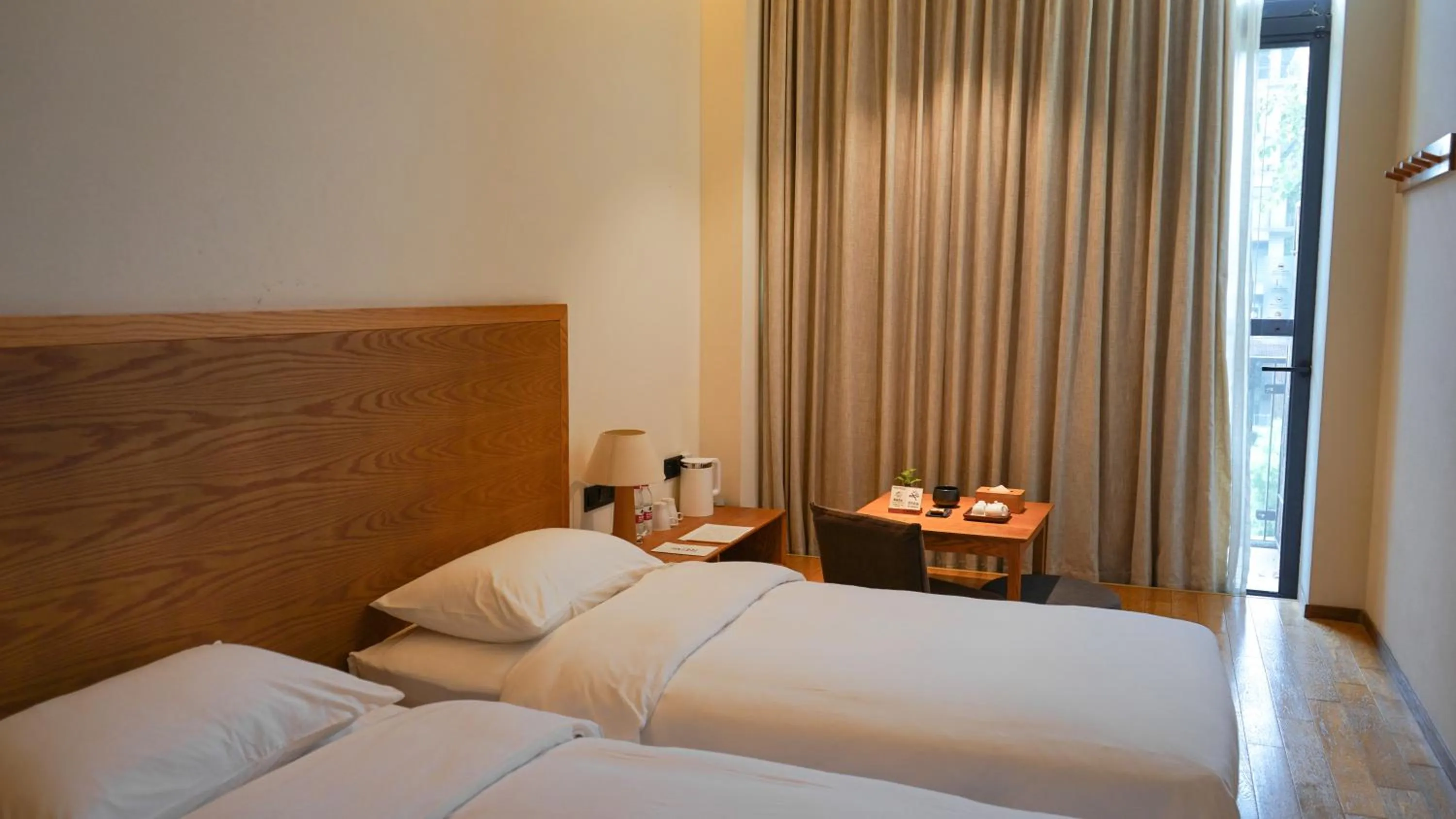 Property building, Bed in Taihua Wutong Hotel