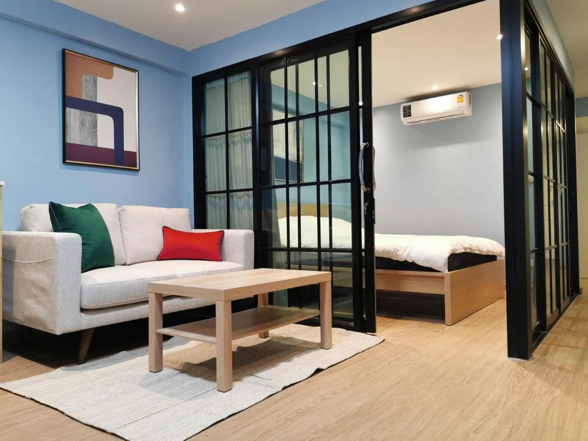 Living room, Bed in BEB Silom Condolette