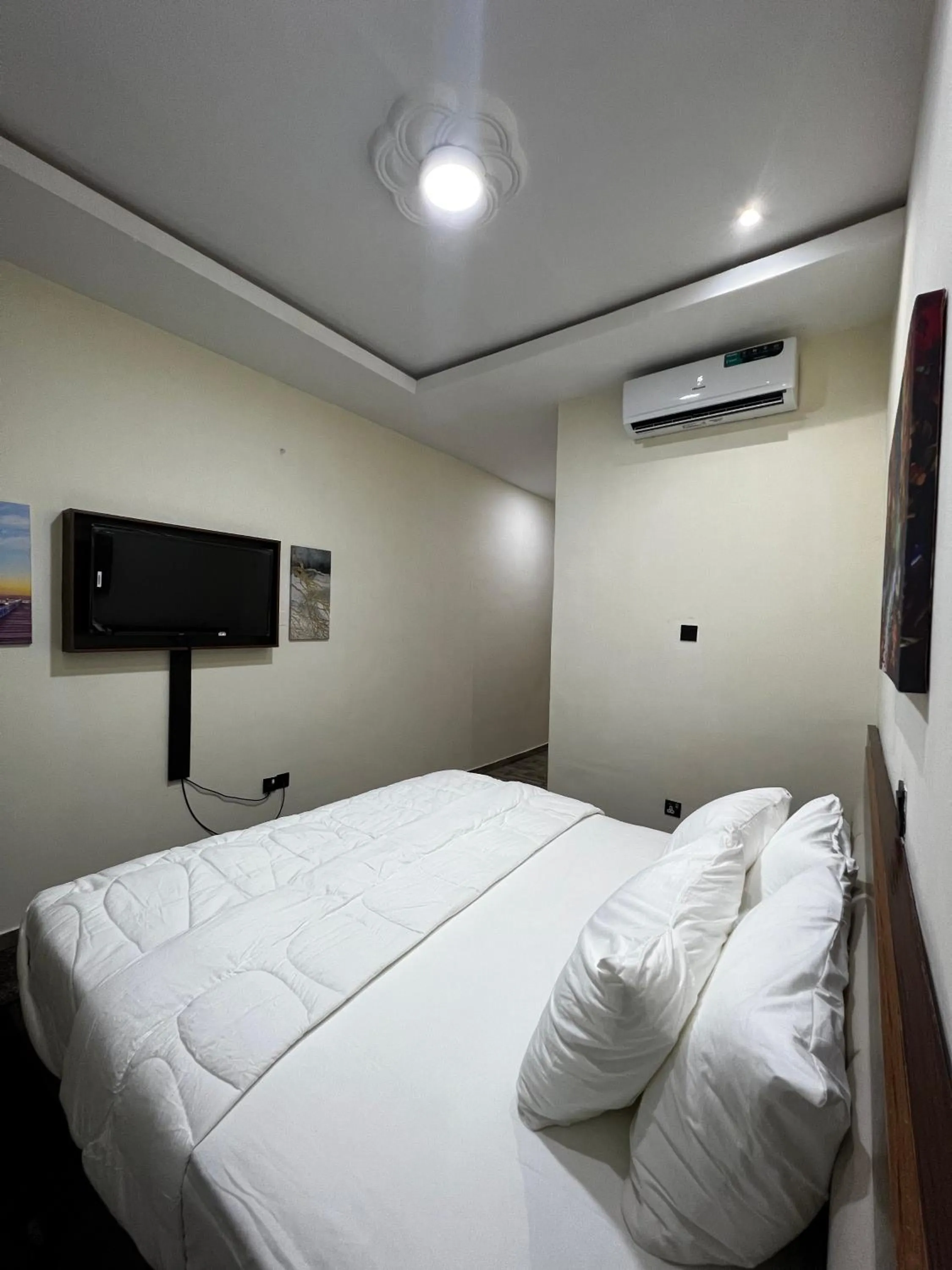 Bed in Fragrance Apartments and Suites