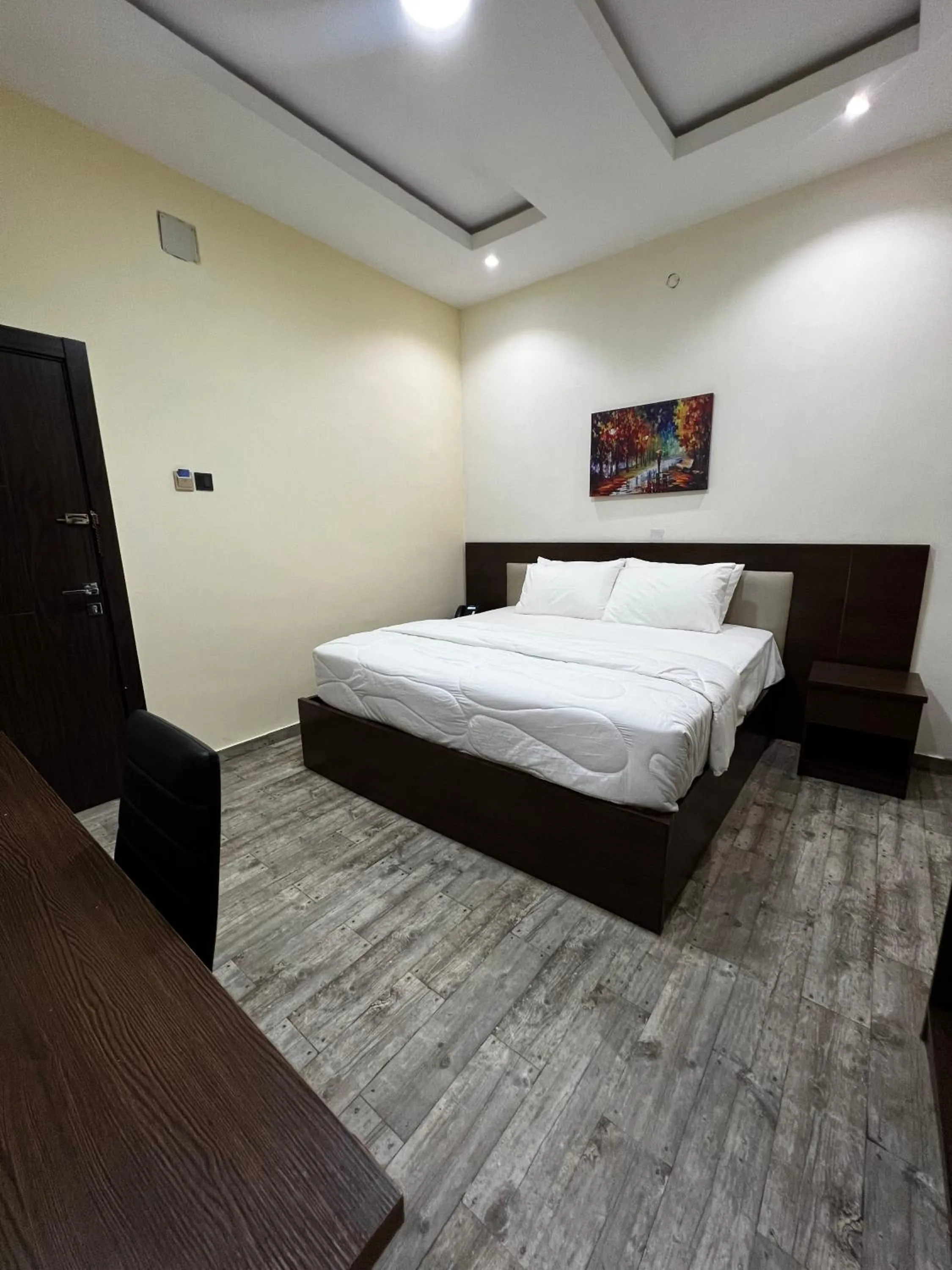 Bed in Fragrance Apartments and Suites