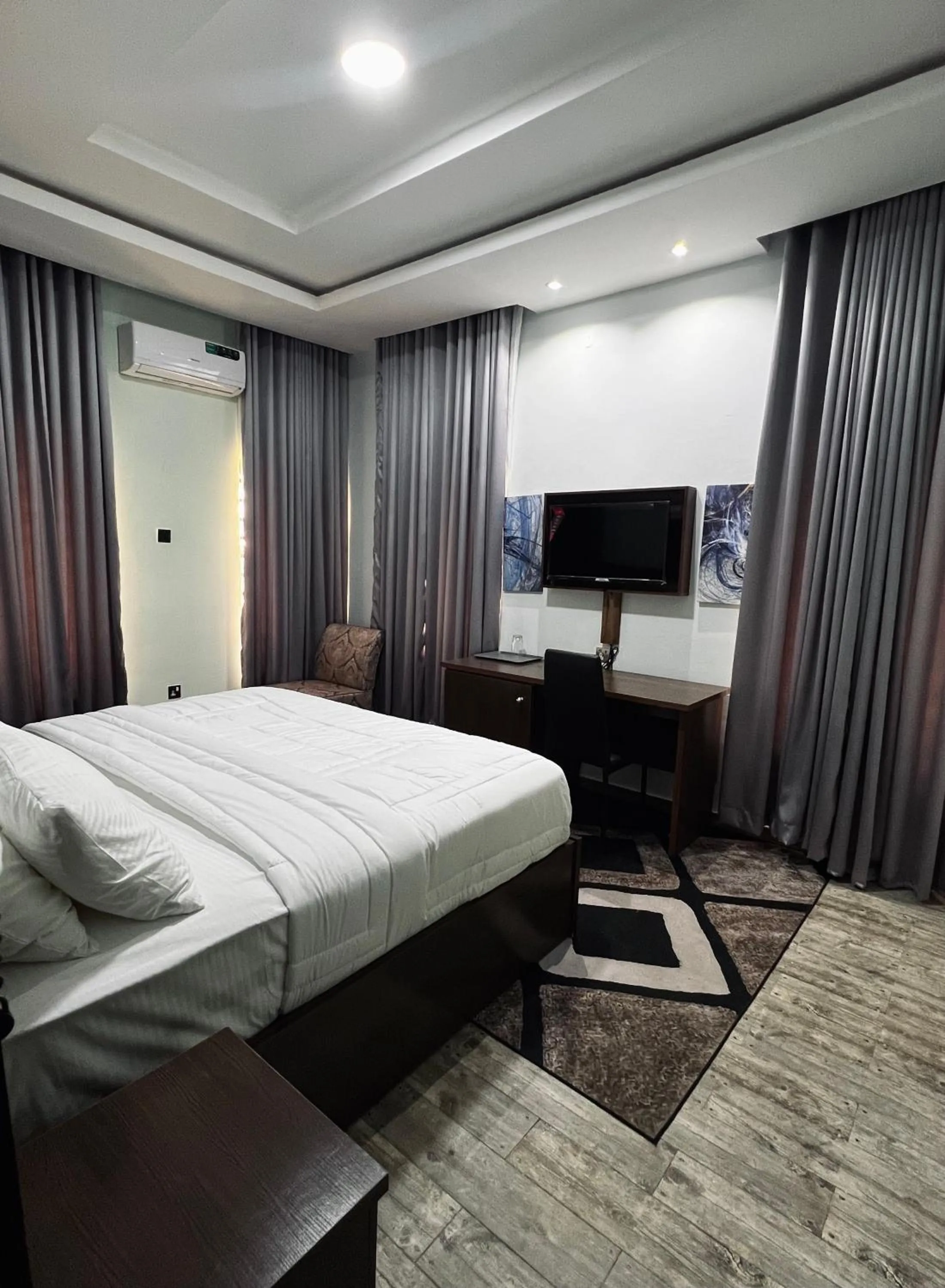 Bed in Fragrance Apartments and Suites