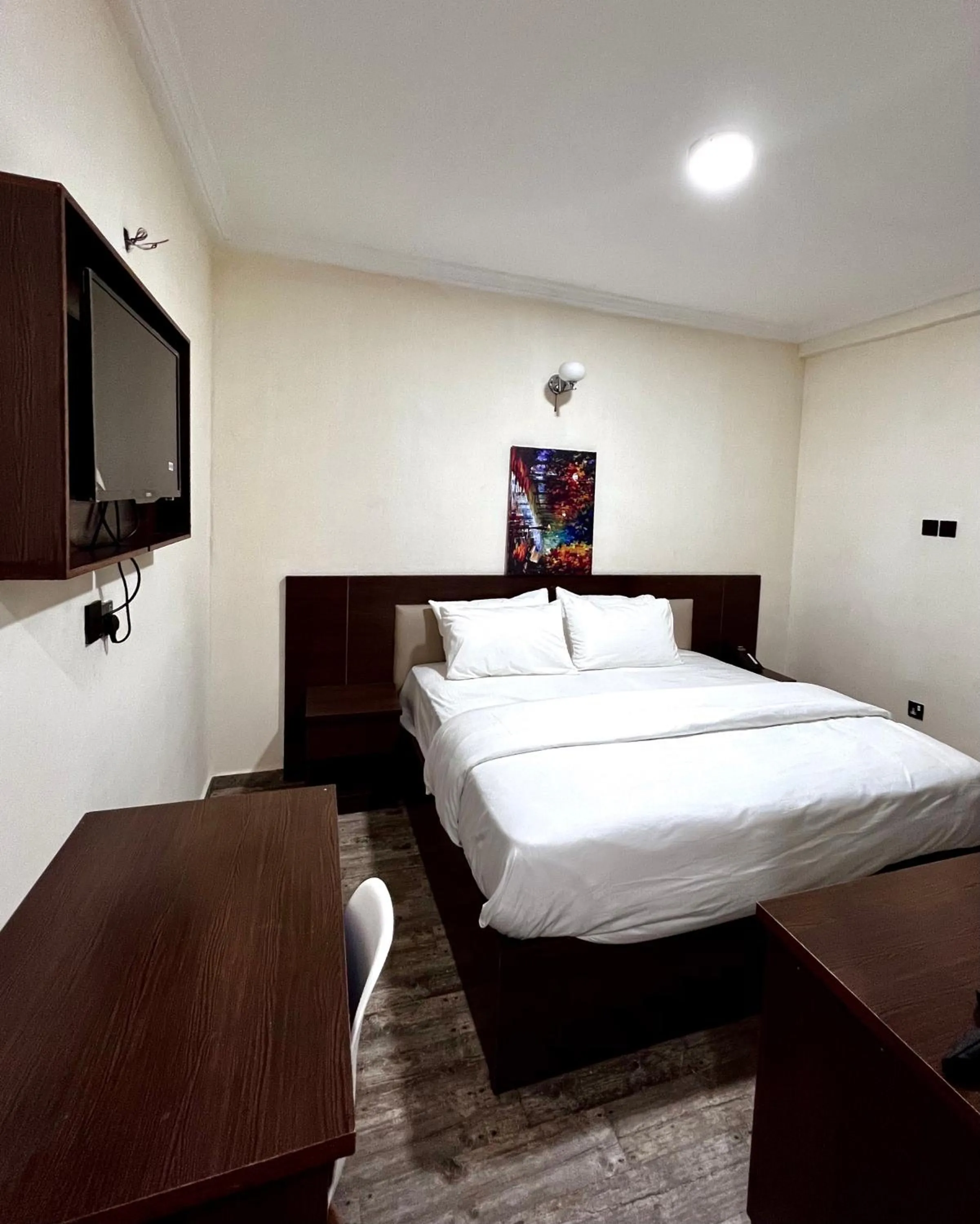 Bed in Fragrance Apartments and Suites