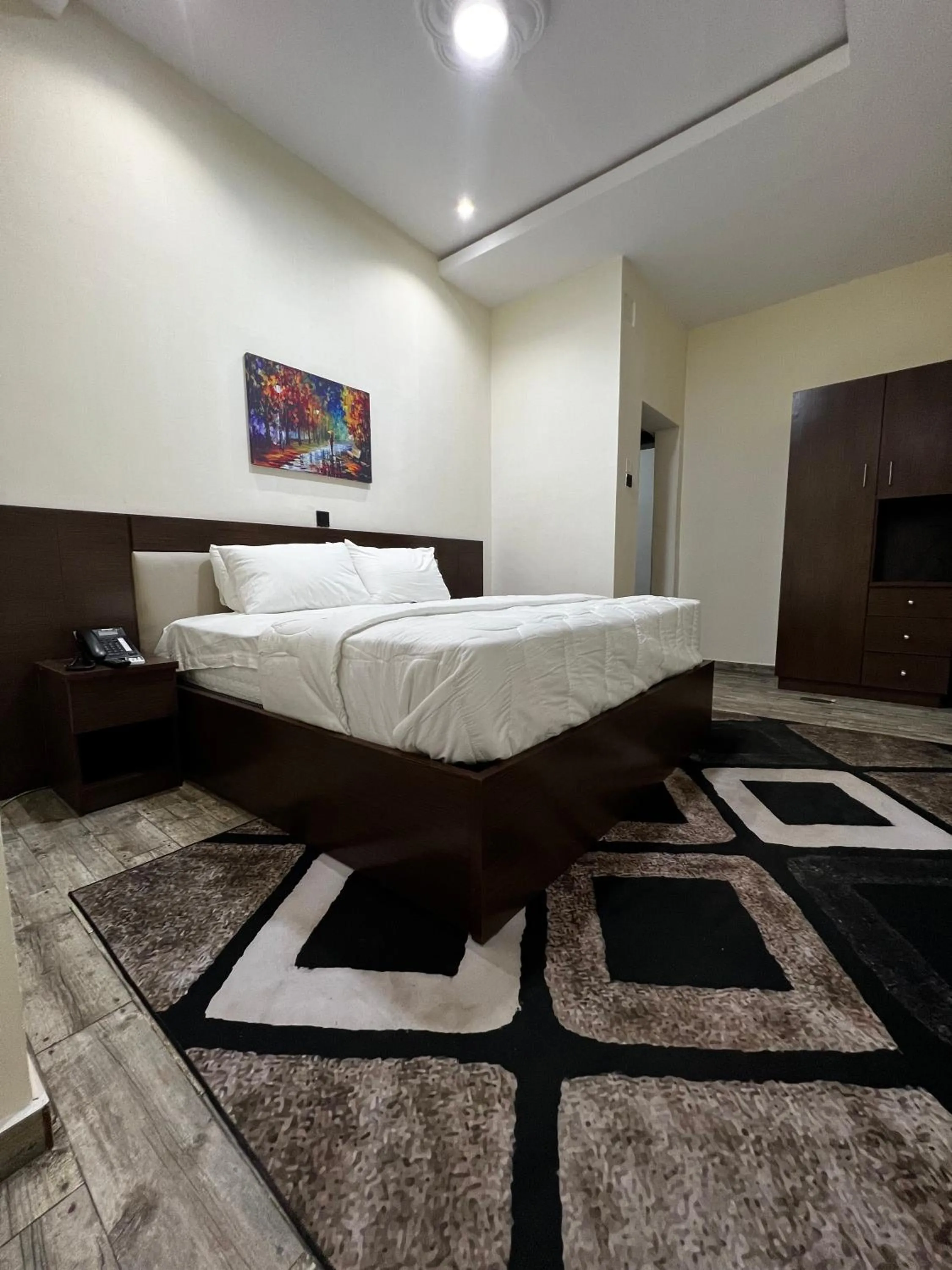 Bed in Fragrance Apartments and Suites