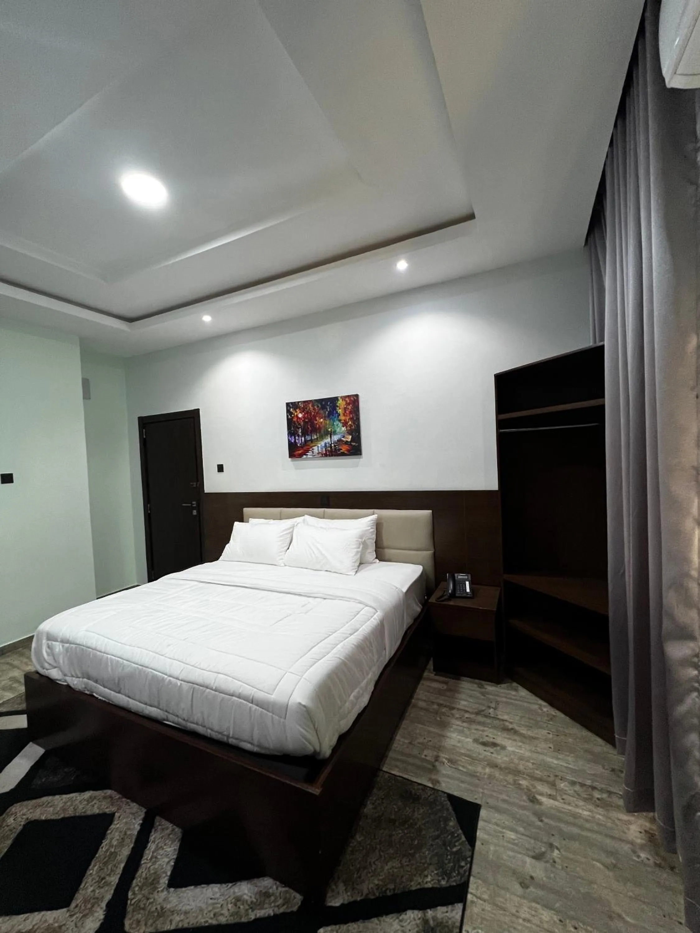 Bed in Fragrance Apartments and Suites