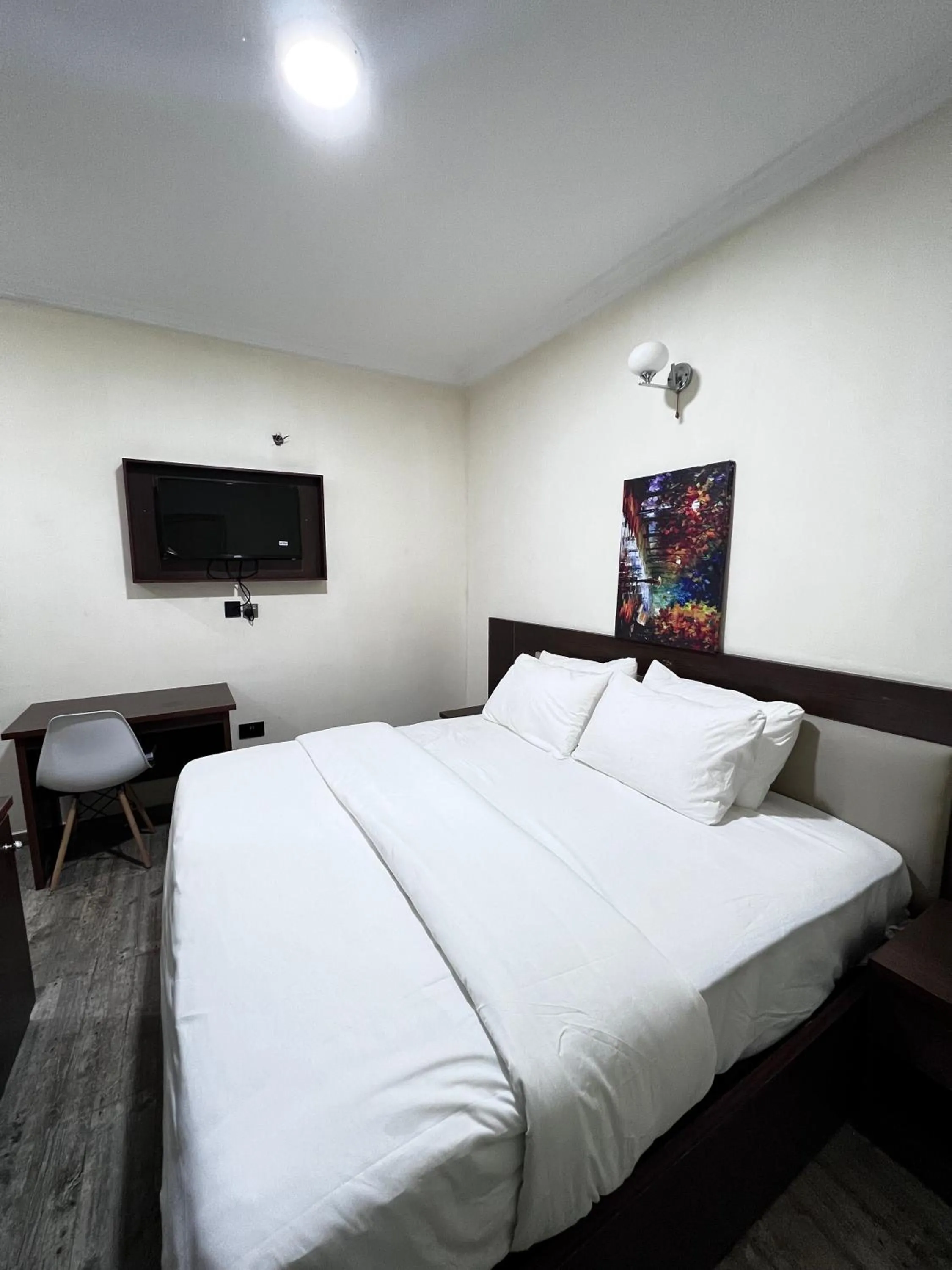 Bed in Fragrance Apartments and Suites