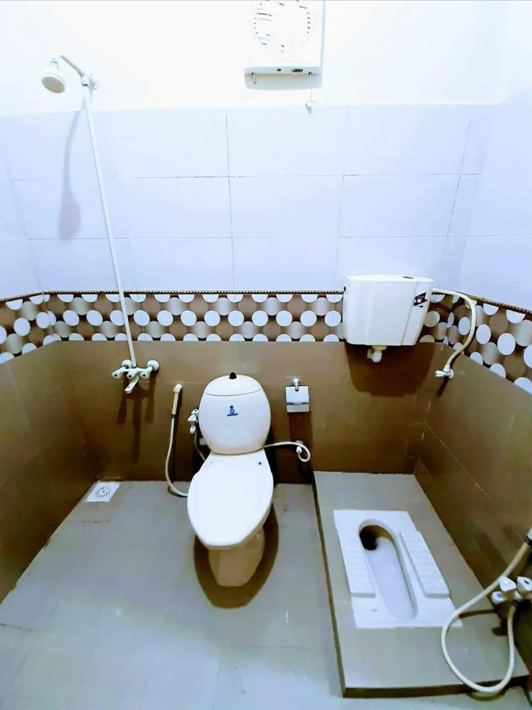 Toilet in Galaxy Inn Guest House