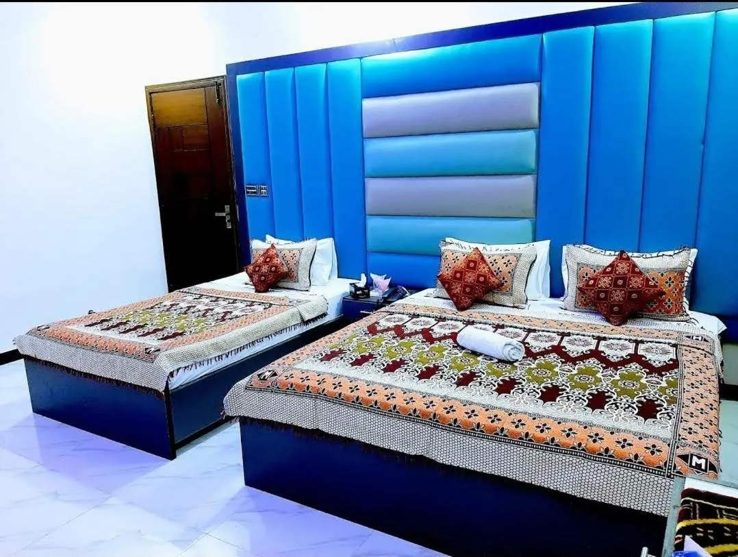 Bed in Galaxy Inn Guest House