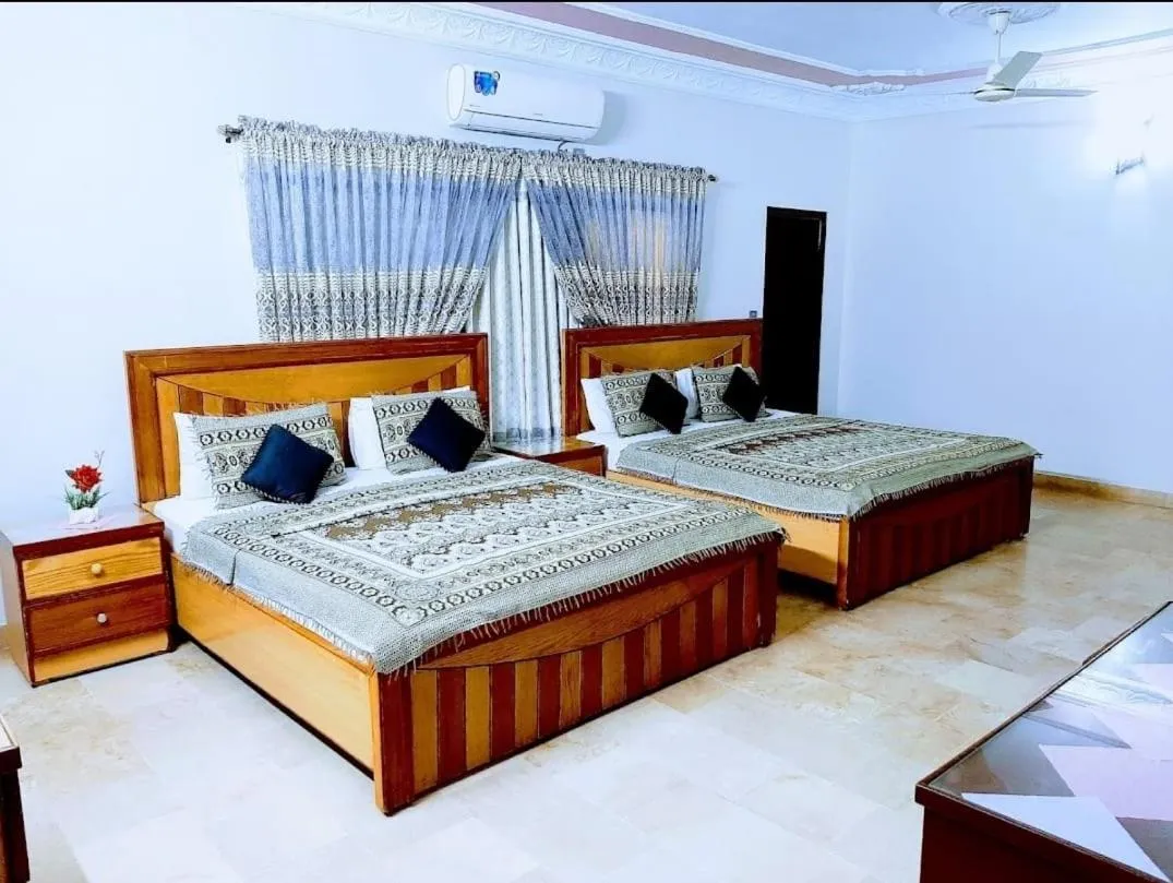 Bed in Galaxy Inn Guest House