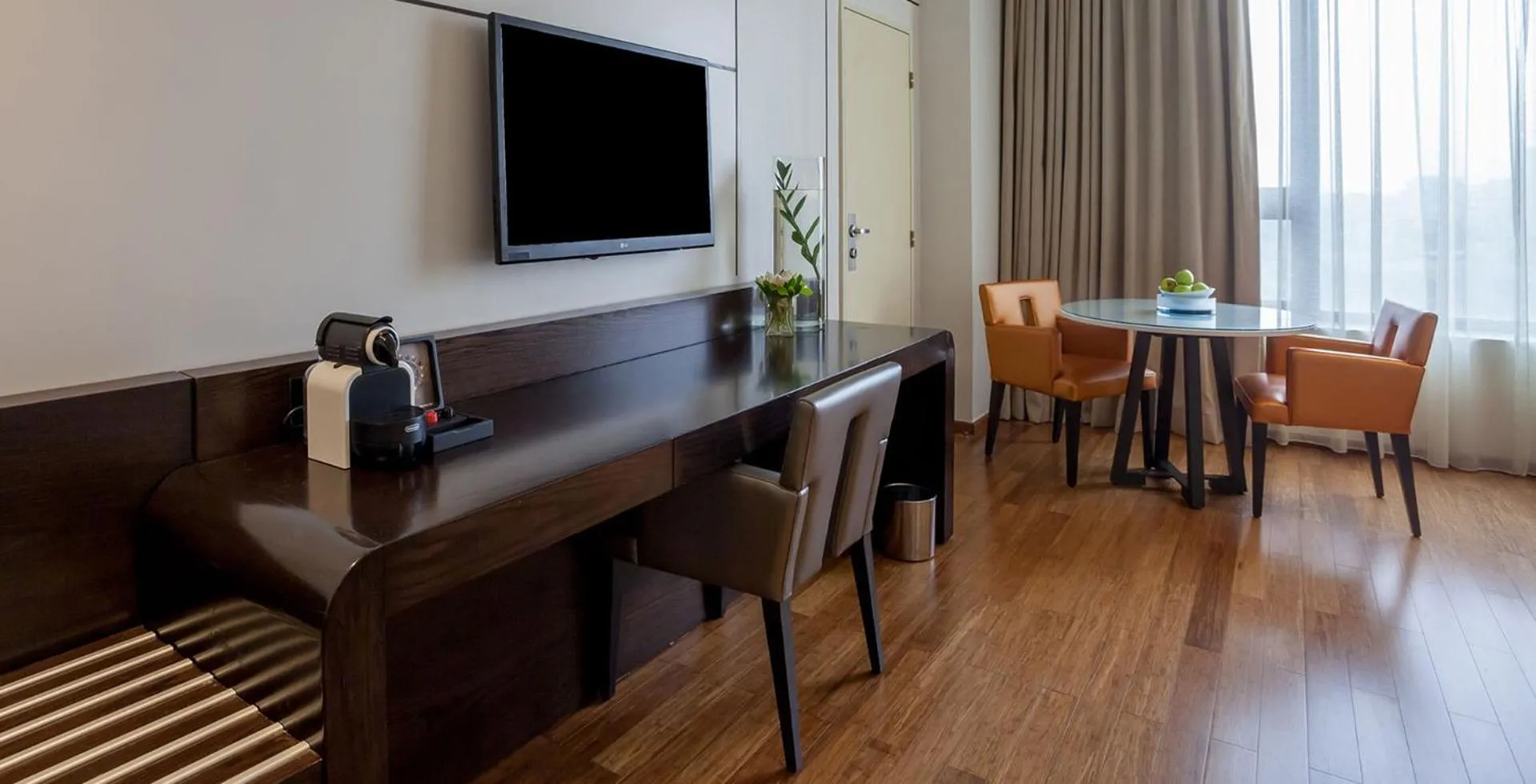 Communal lounge/ TV room in Eko Hotel Signature