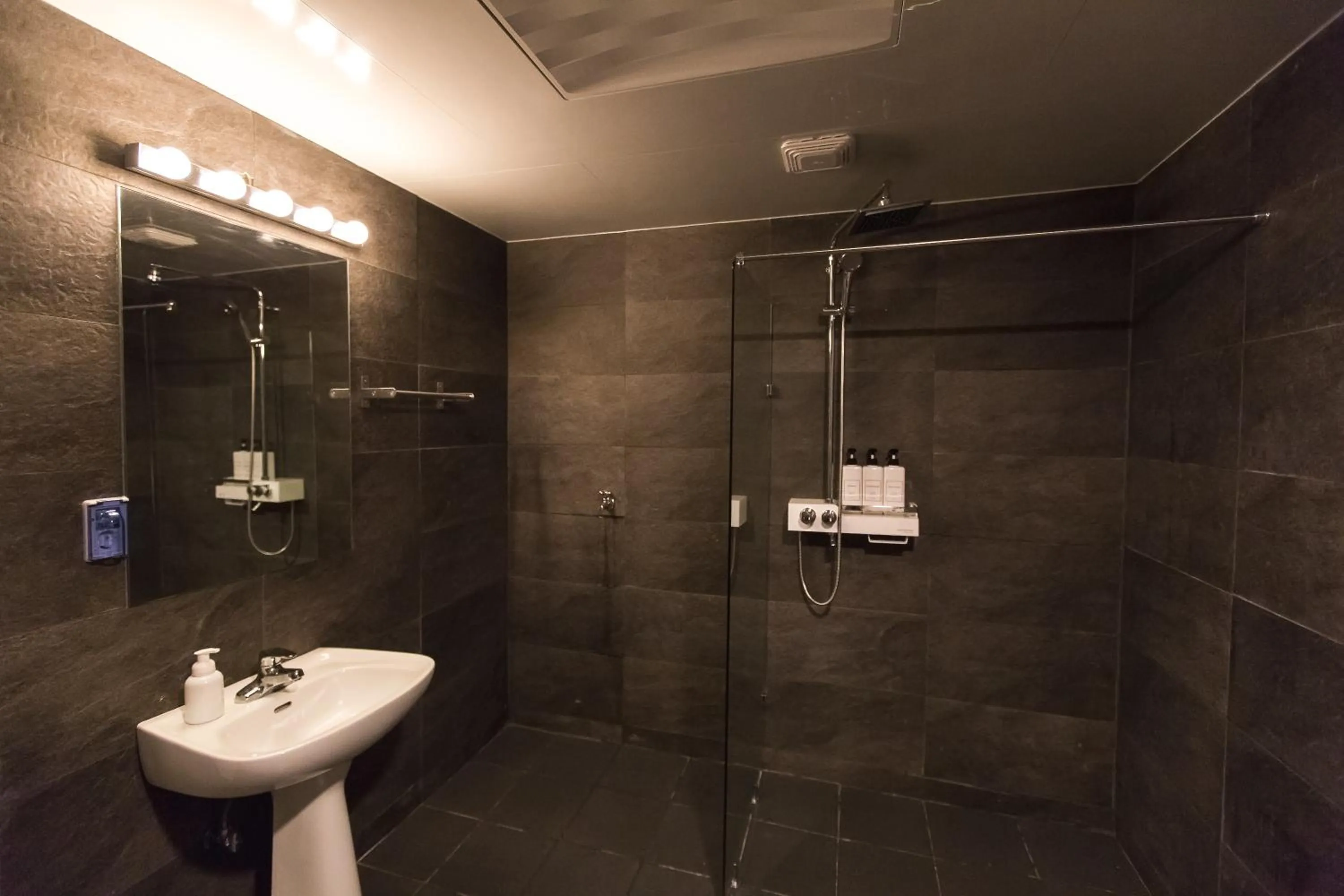 Shower in CANVAS BLACK Guesthouse