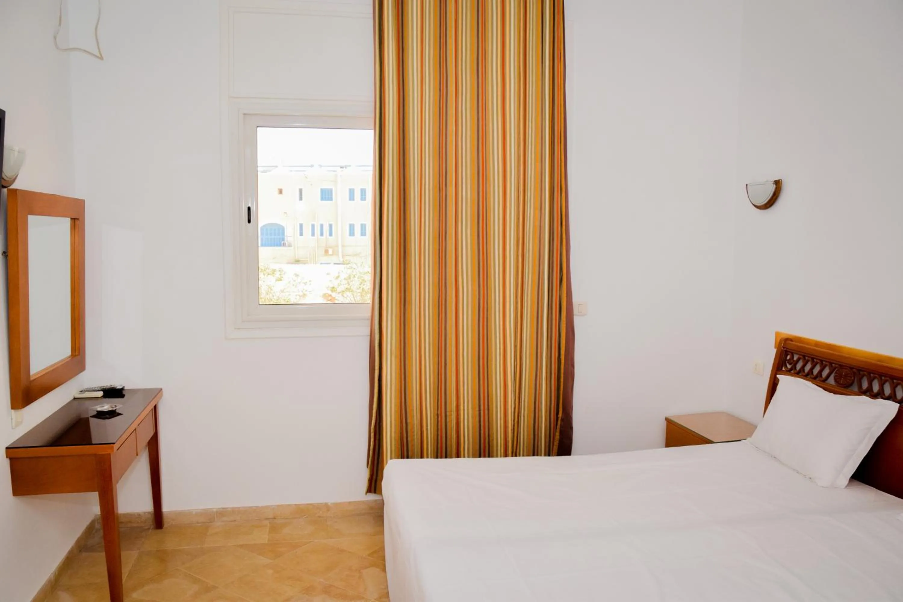 Bed in Le Grand Hotel Djerba