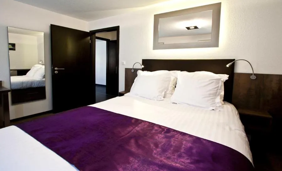 Bed in Appartements Le Hupsa Pfannala