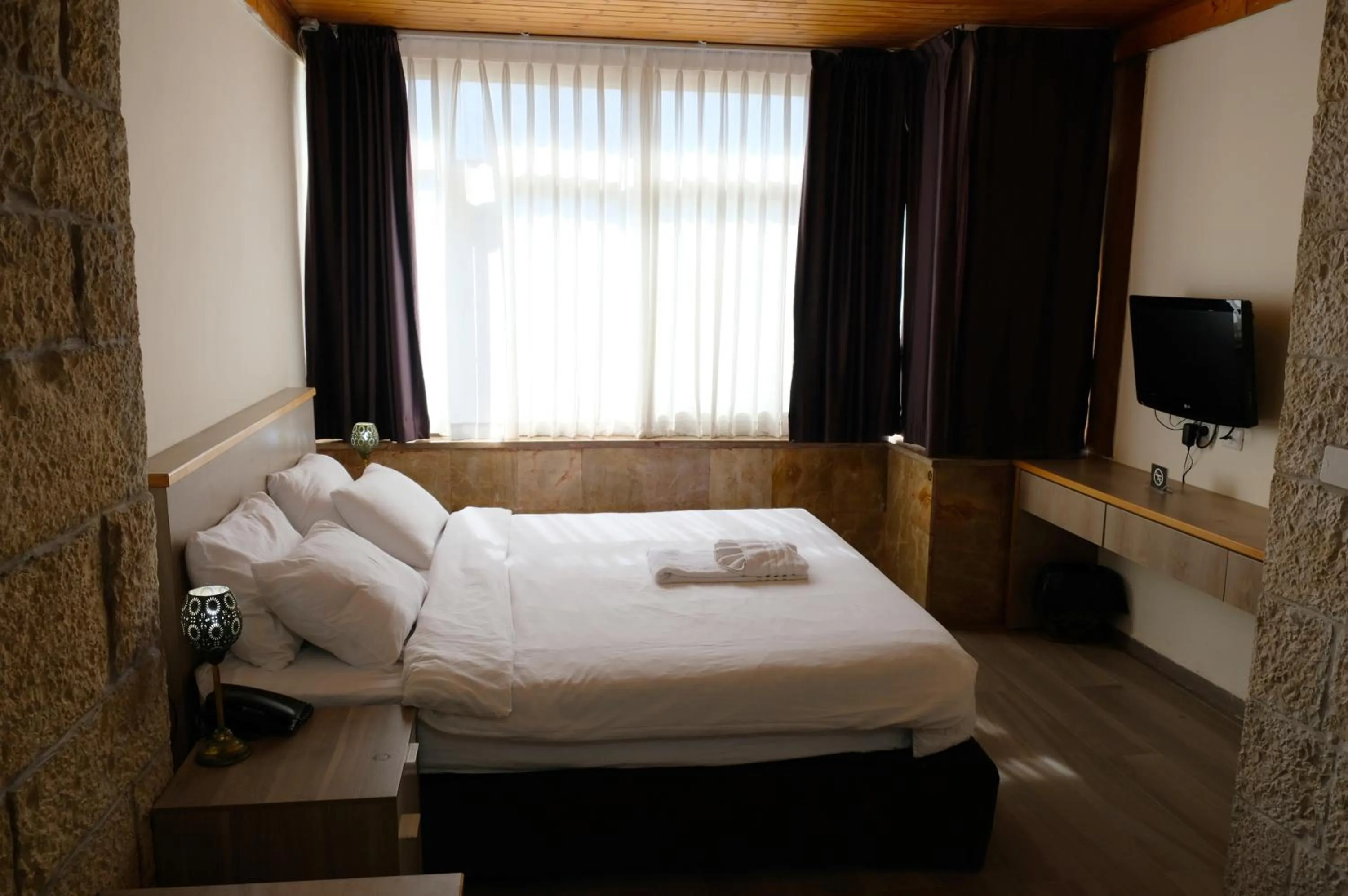 Bedroom, Bed in St. George’s Cathedral Pilgrim Guesthouse – Jerusalem