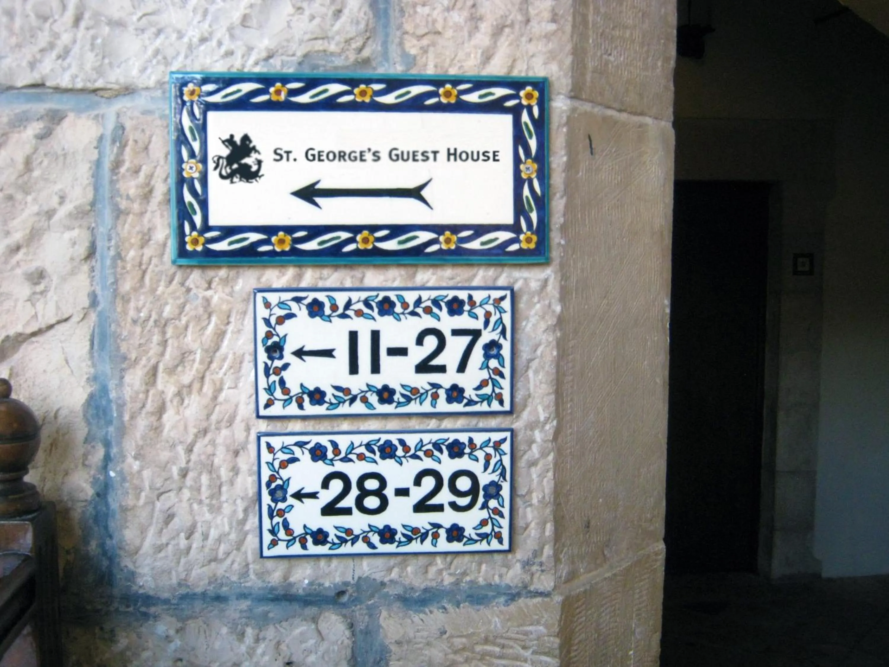 Logo/Certificate/Sign in St. George’s Cathedral Pilgrim Guesthouse – Jerusalem