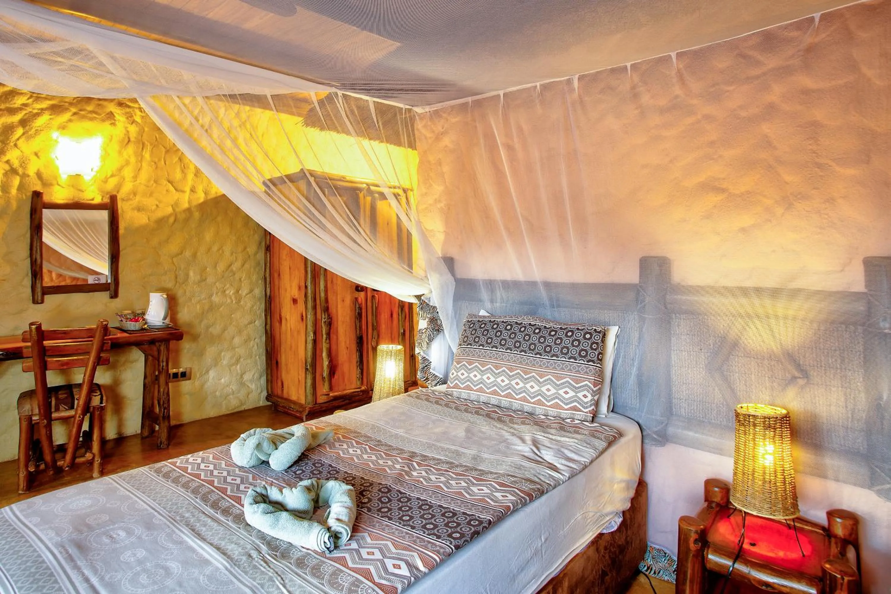 Bed in Kubu Safari Lodge