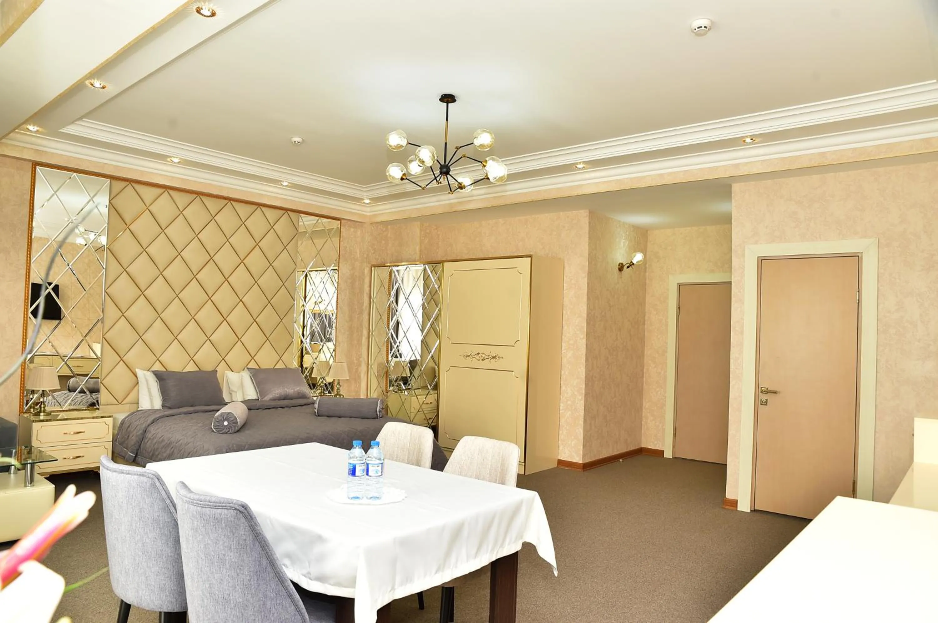 Bed in Karat Inn Boutique Hotel