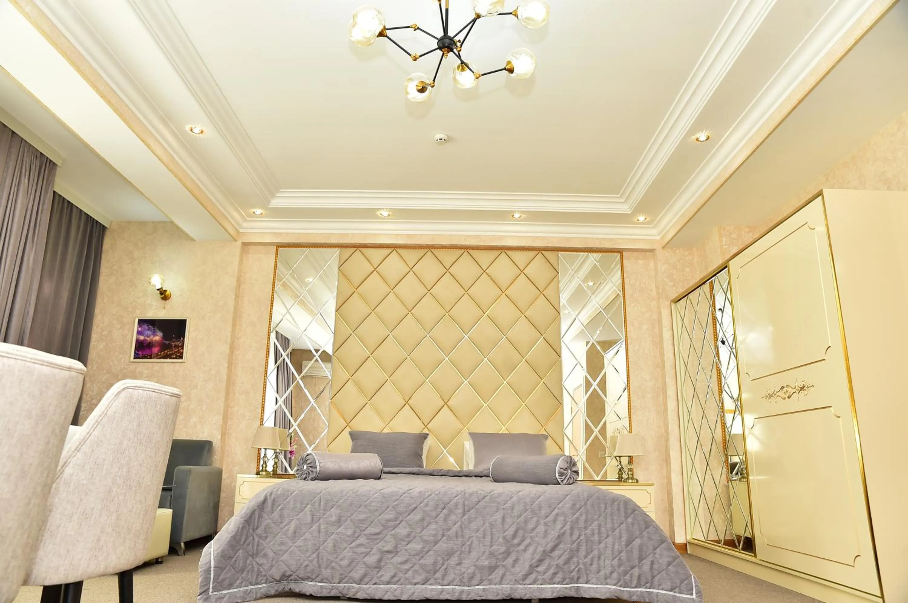Bed in Karat Inn Boutique Hotel