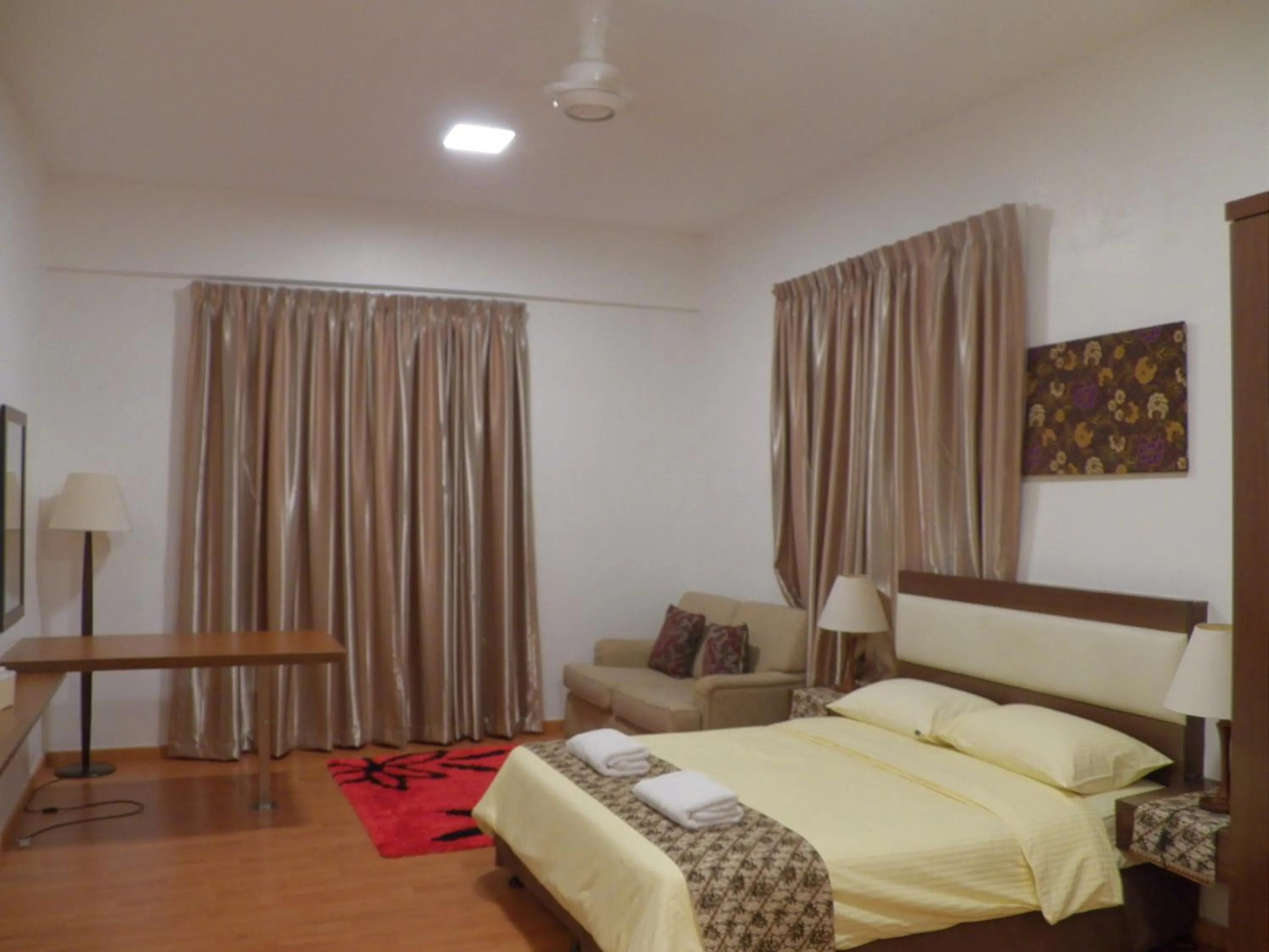 Bed in Maytower Apartment