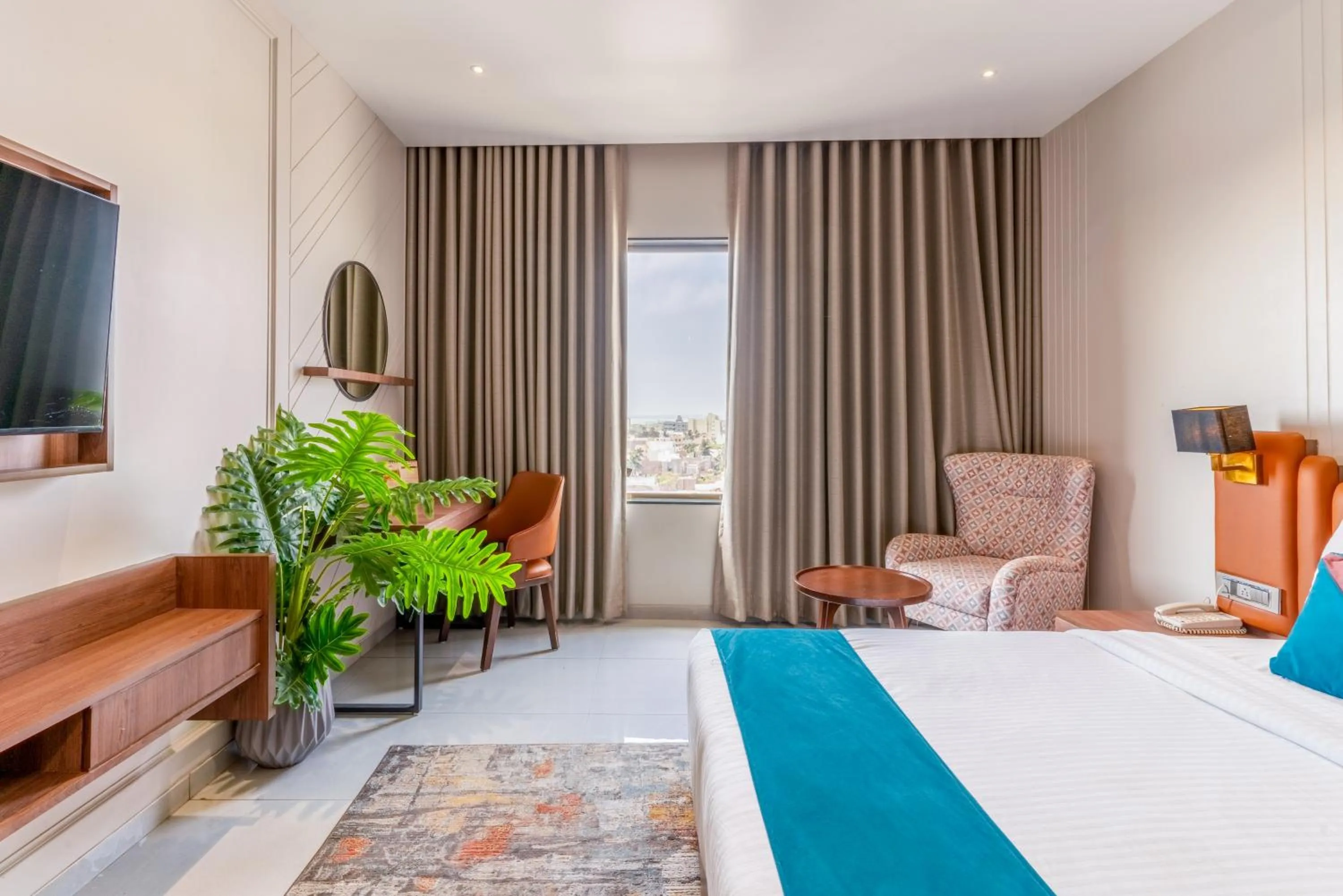 Photo of the whole room, Bed in Pride Elite Dwarka Near Dwarkadhish Temple