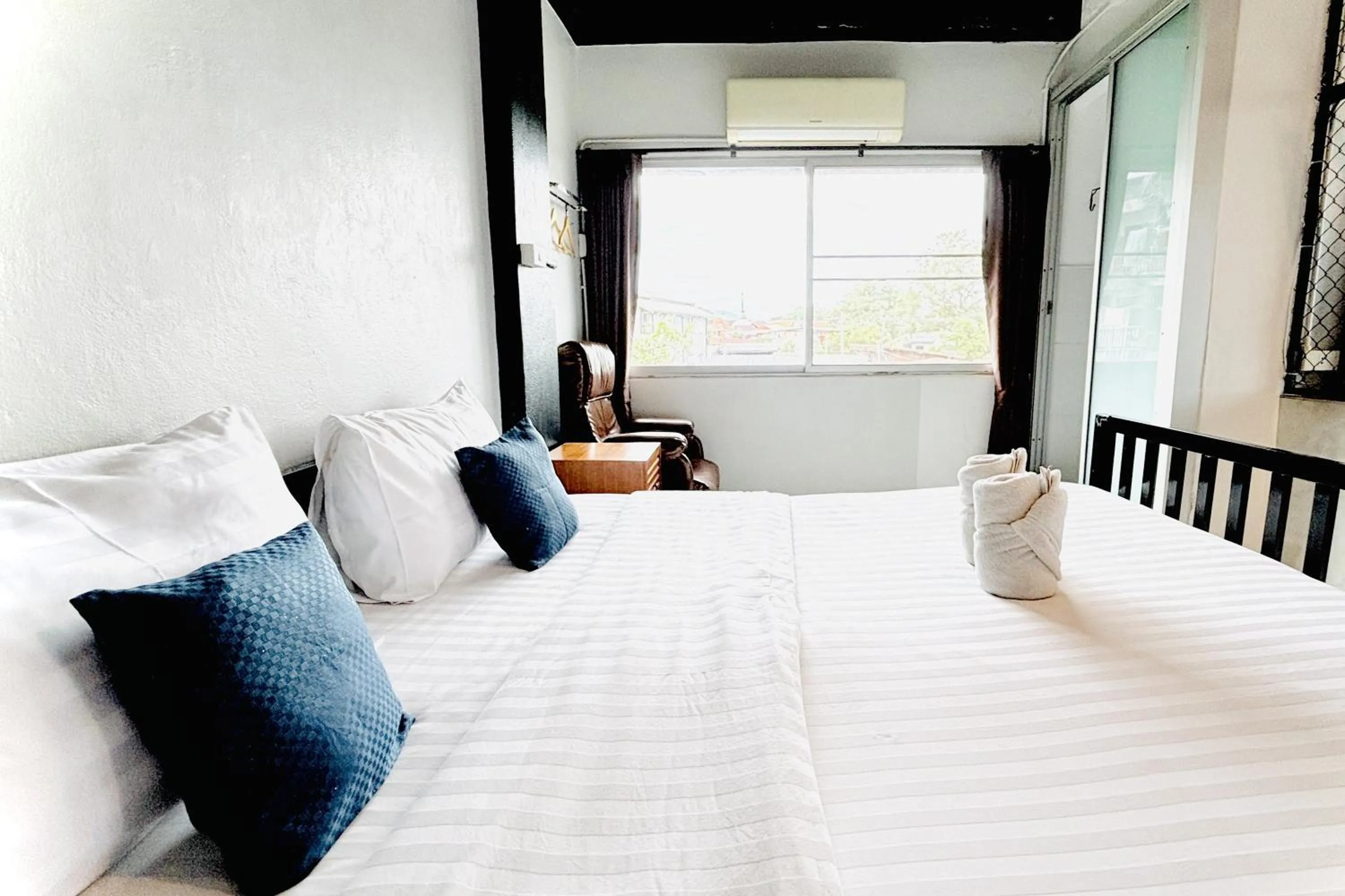 Bed in The Yak Cozy Chiang Mai