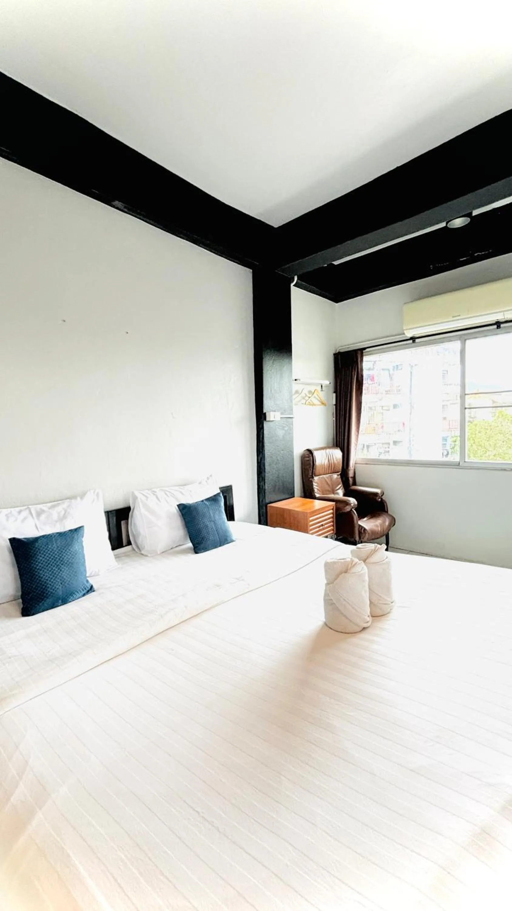 Bed in The Yak Cozy Chiang Mai