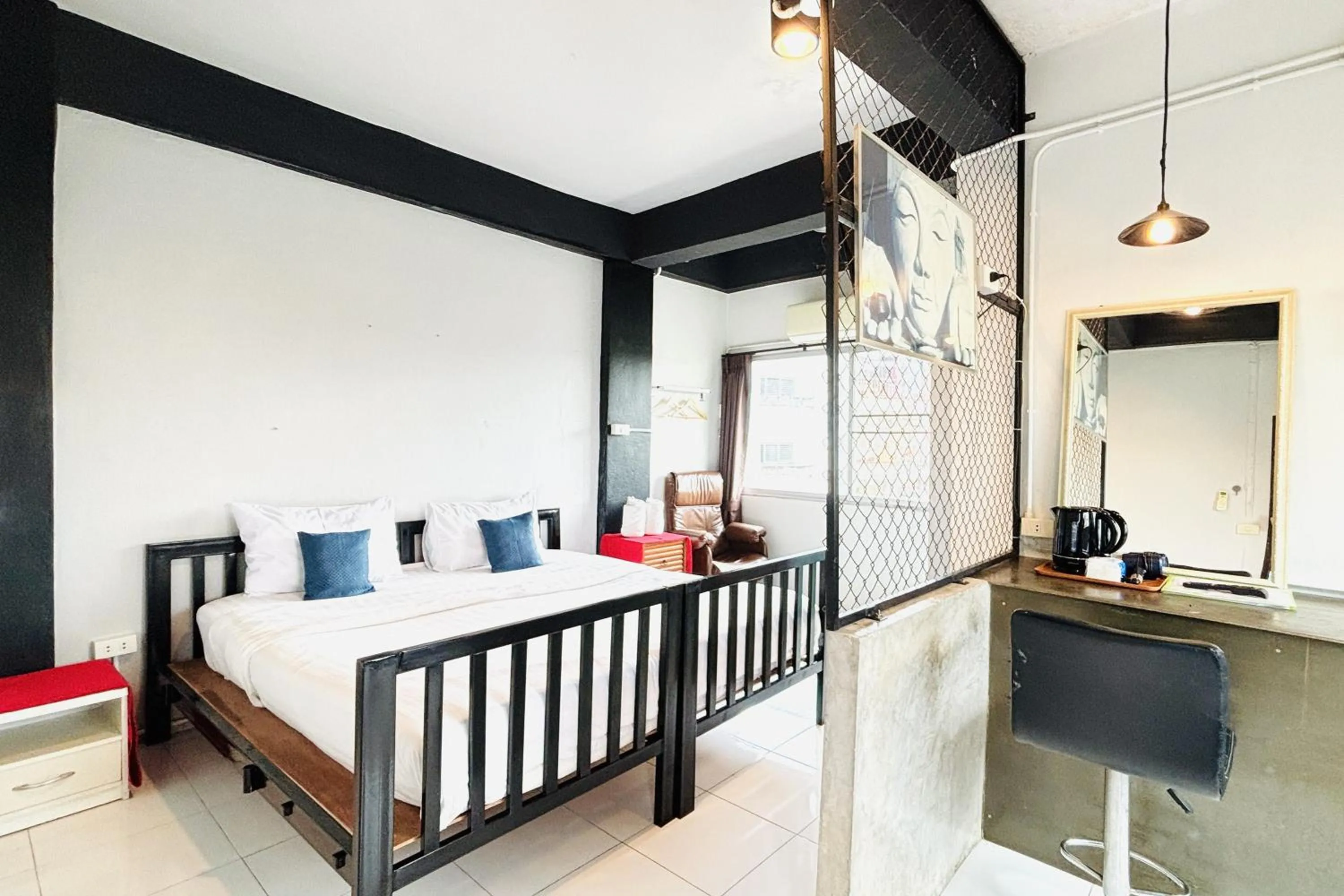 Bed in The Yak Cozy Chiang Mai