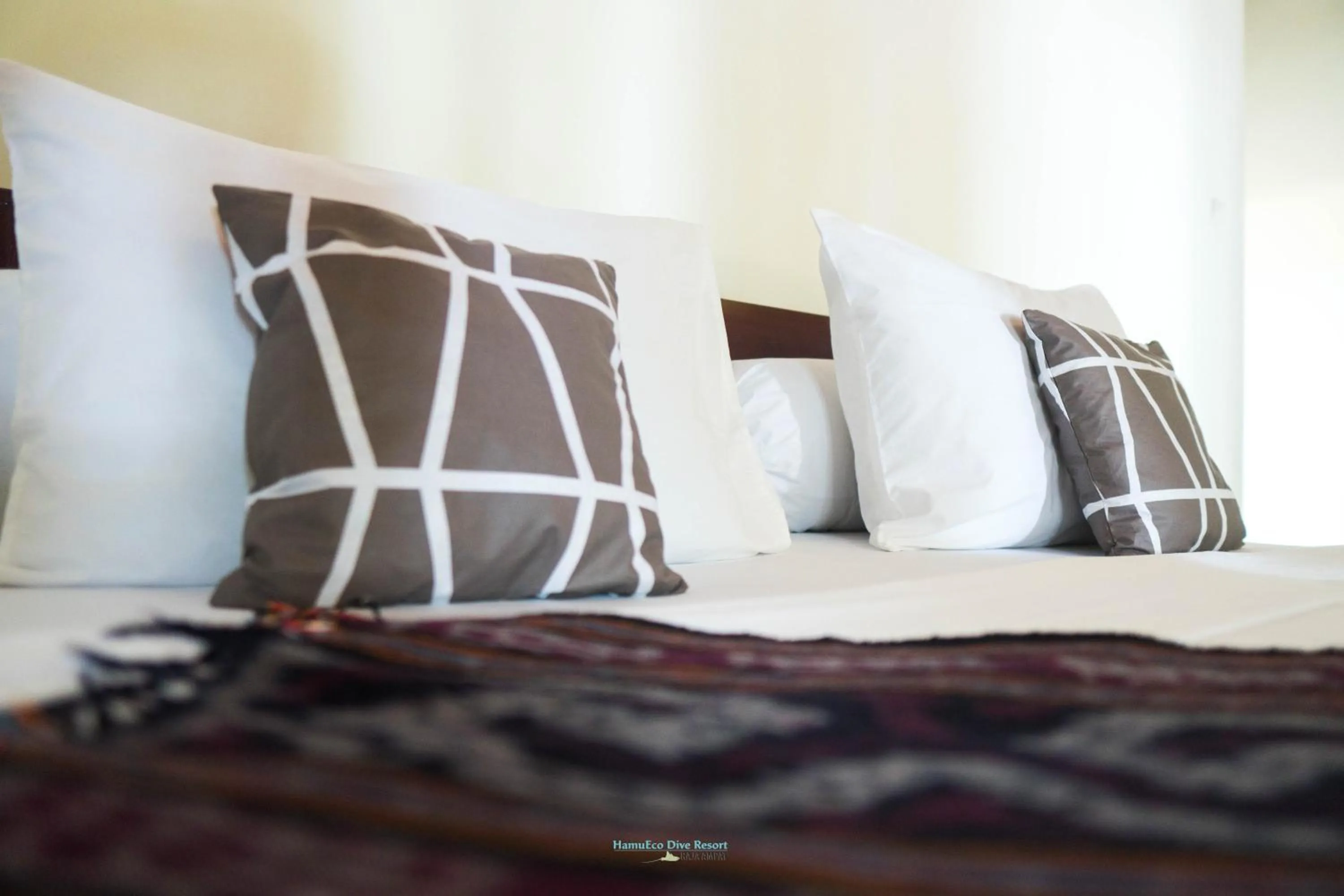Bed in Hamueco Dive Resort Raja Ampat