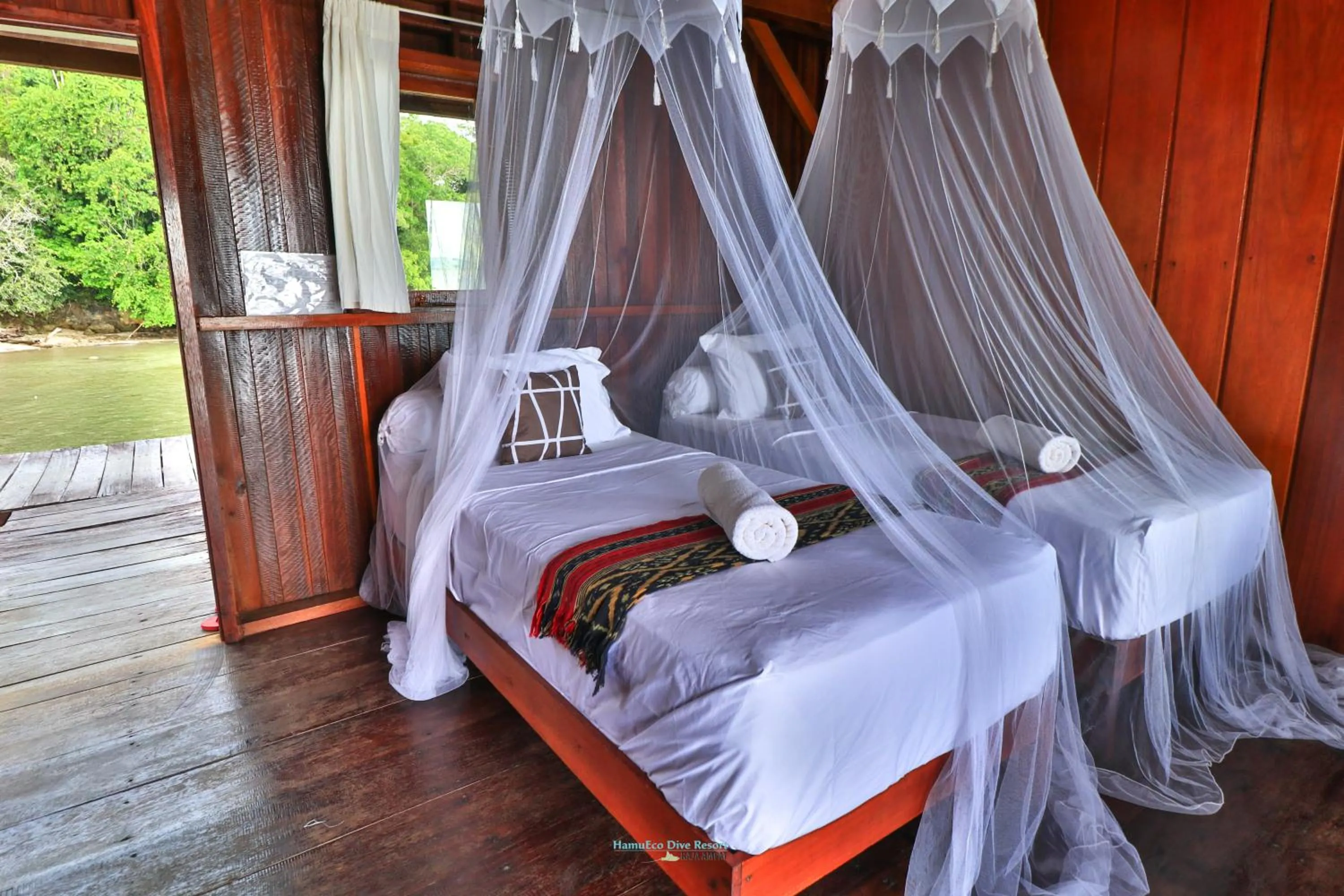 Bed in Hamueco Dive Resort Raja Ampat