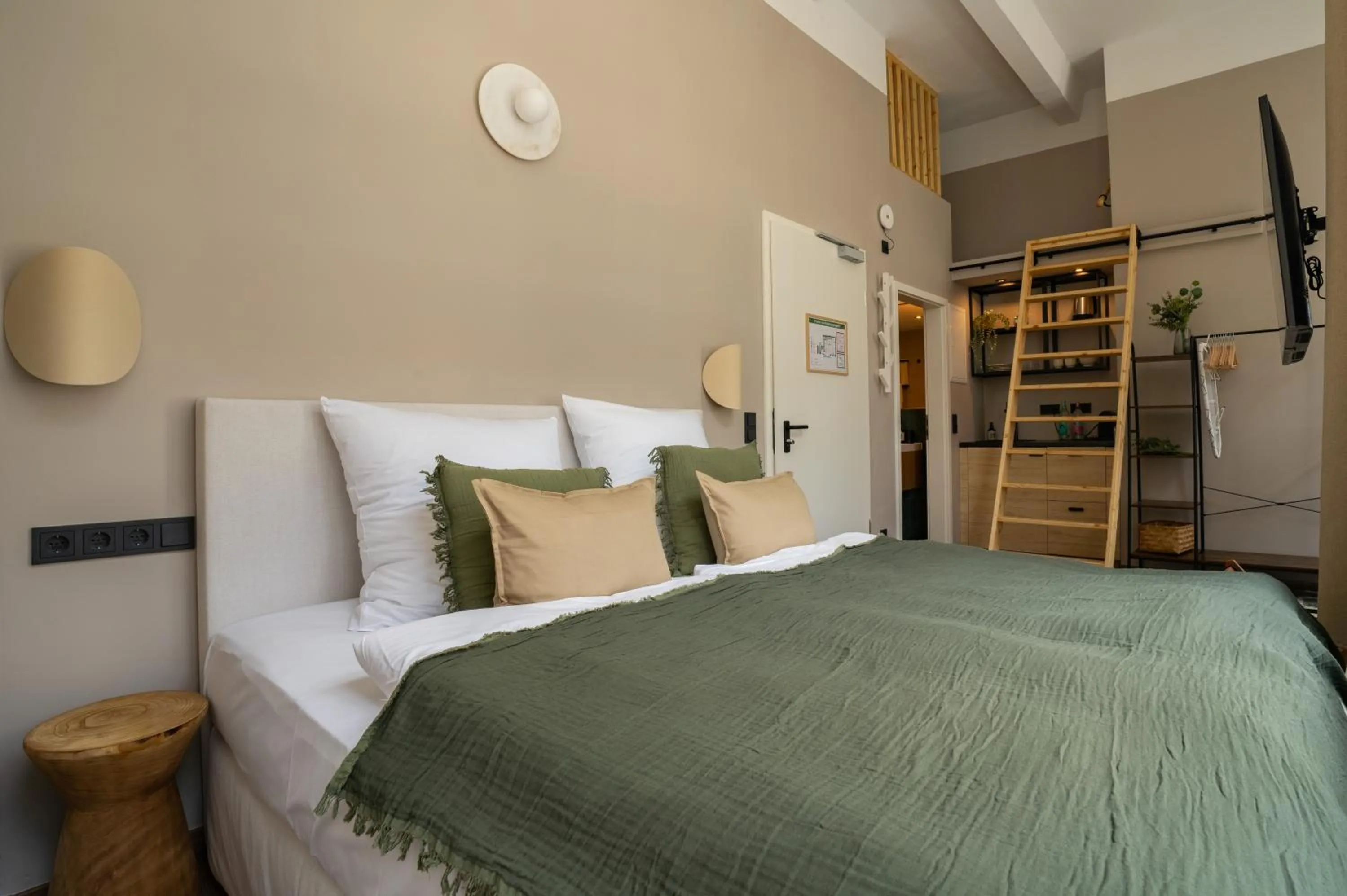 Bed in The Charming by Curt Suites