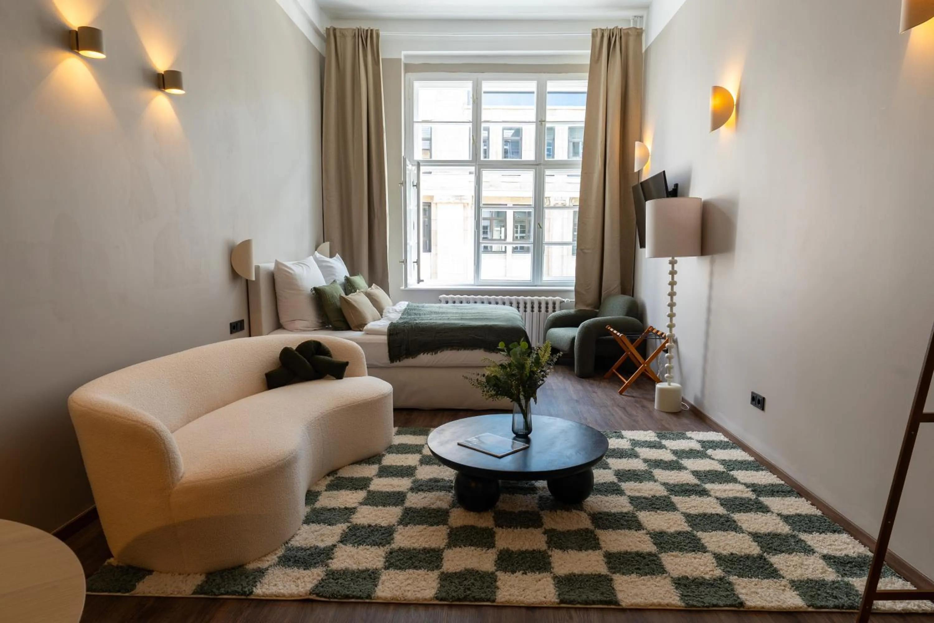 Photo of the whole room in The Charming by Curt Suites