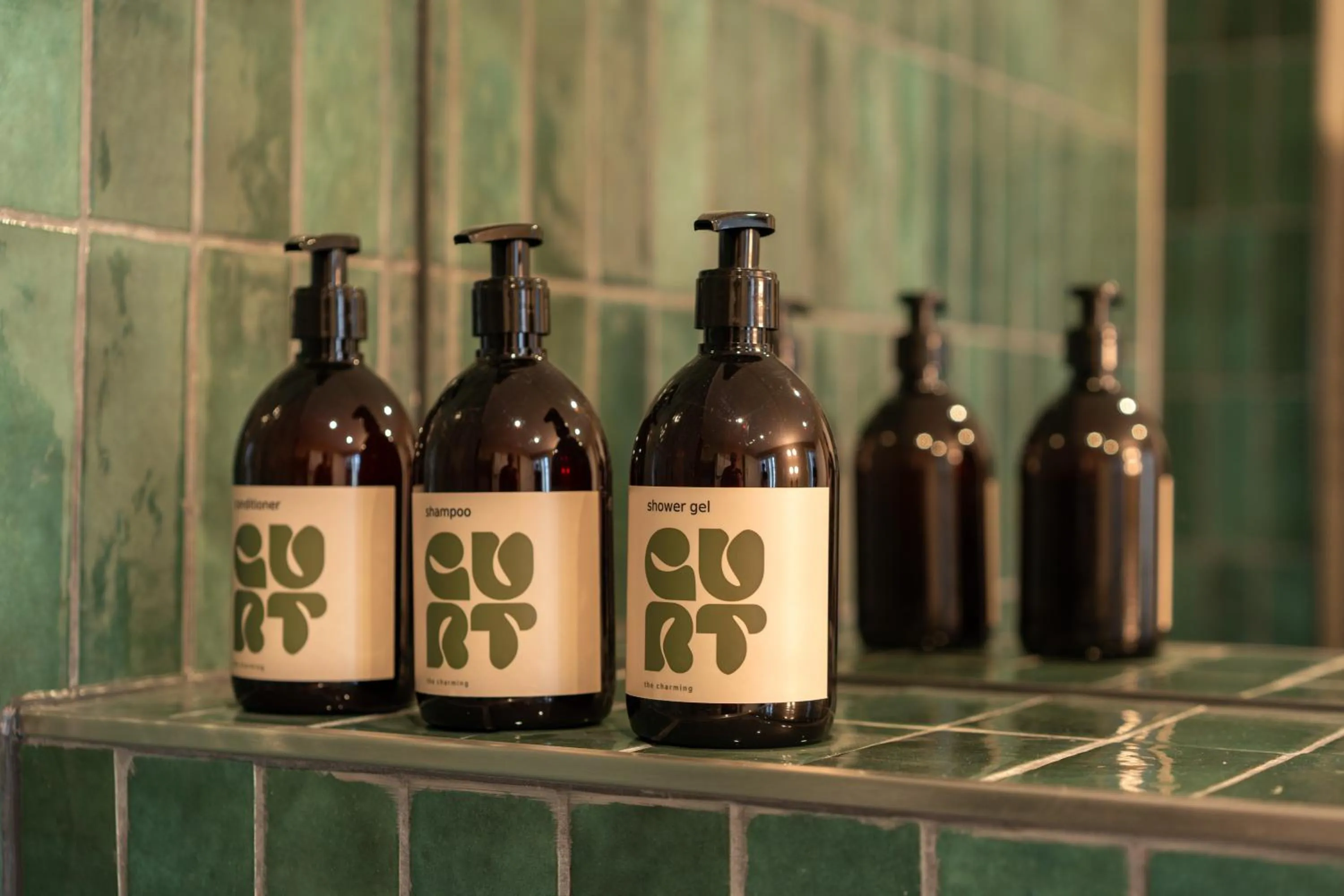 Bathroom in The Charming by Curt Suites