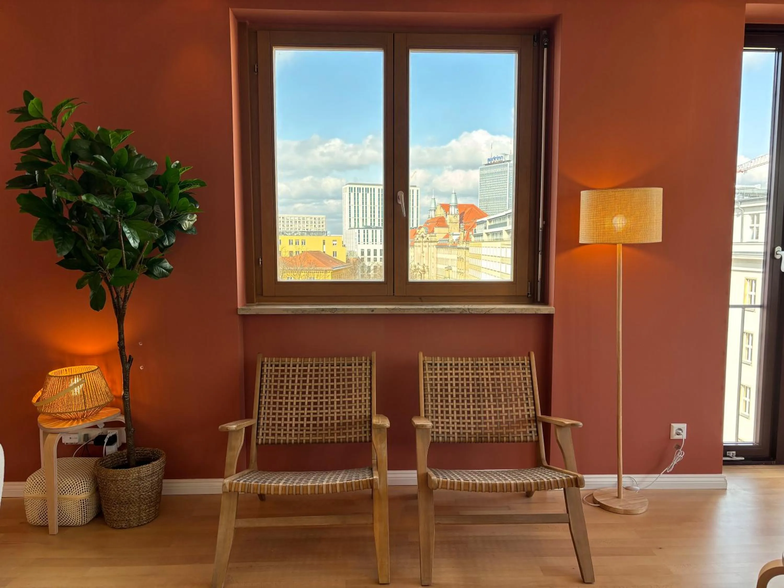 Seating area in The Charming by Curt Suites
