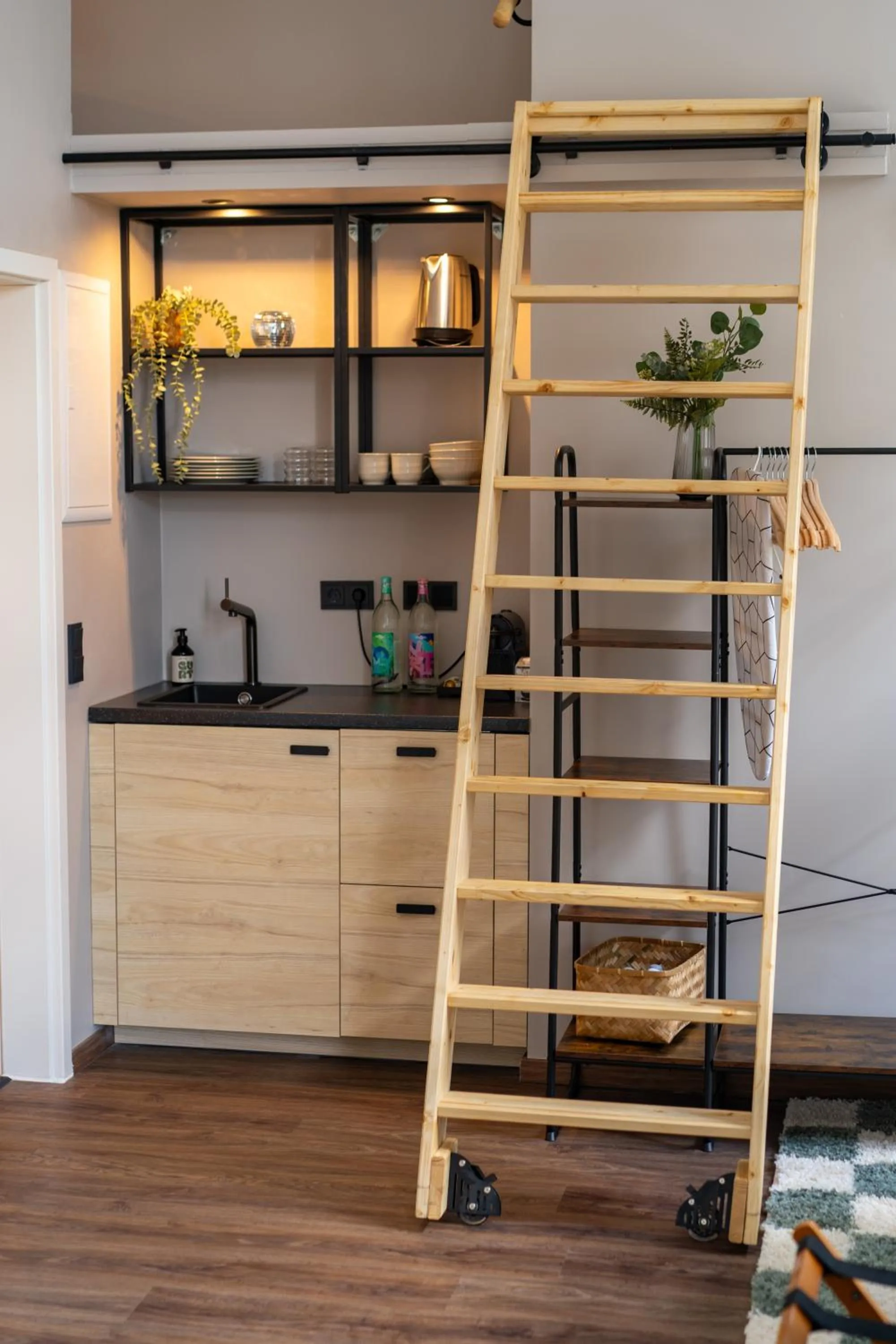 kitchen in The Charming by Curt Suites