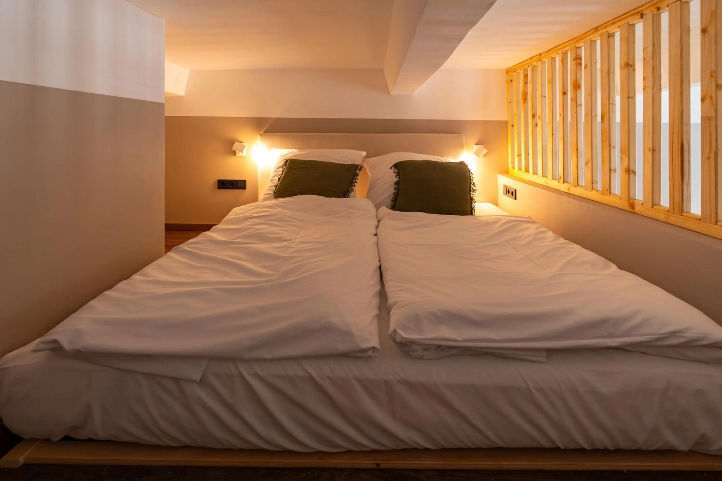 Bed in The Charming by Curt Suites