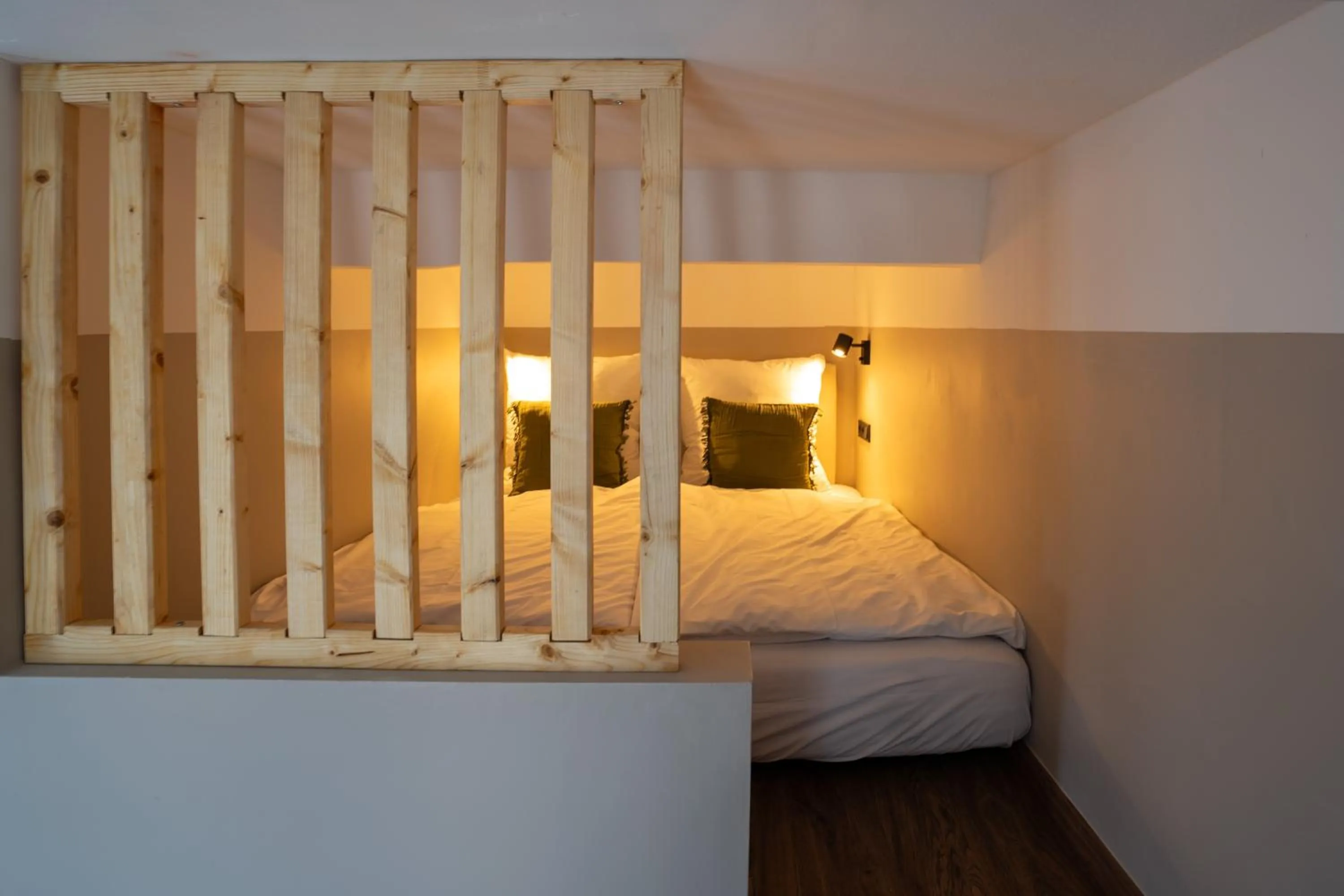 Bed in The Charming by Curt Suites