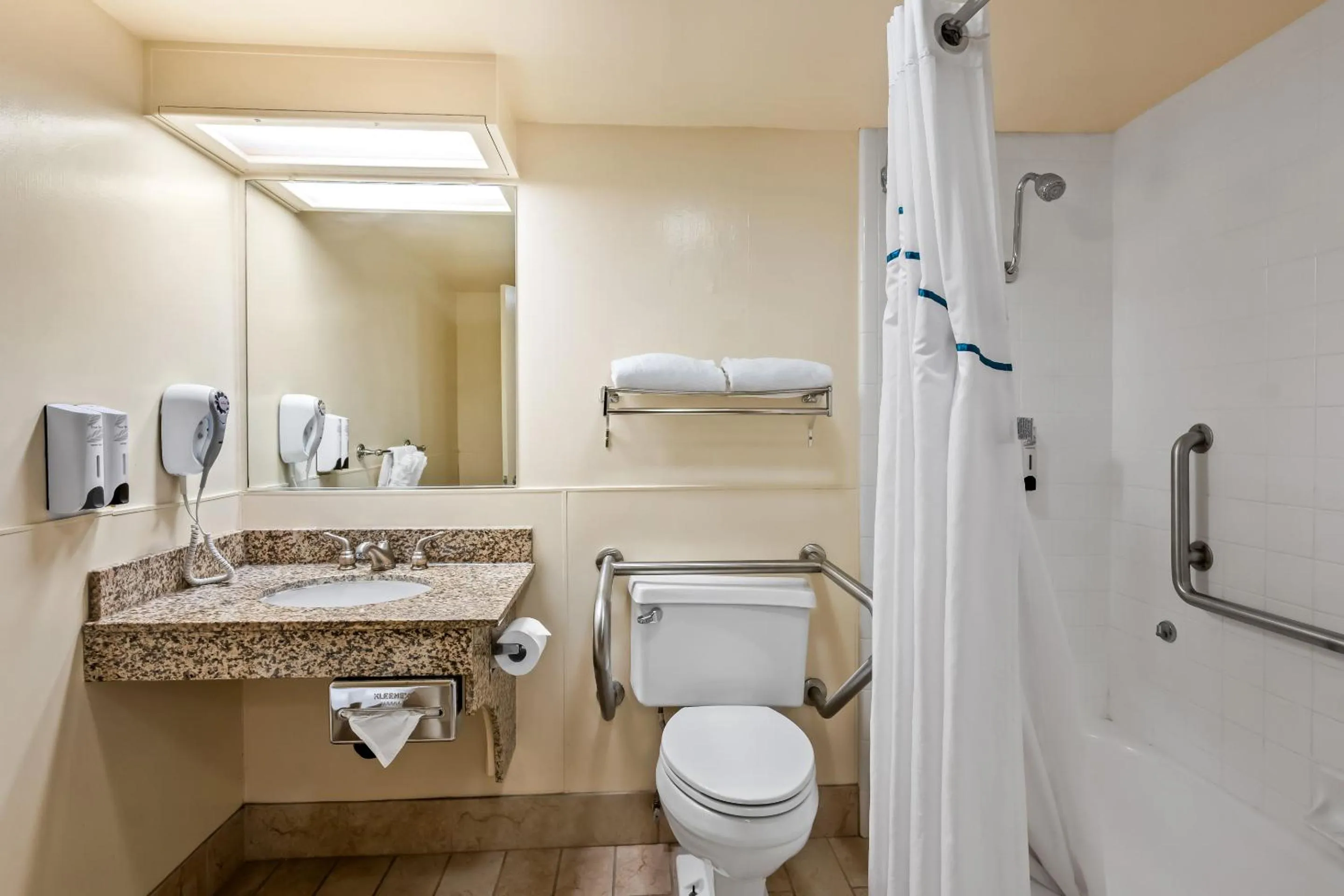 Bathroom in HomeTowne Studios by Red Roof Yuba City Bonanza - Marysville